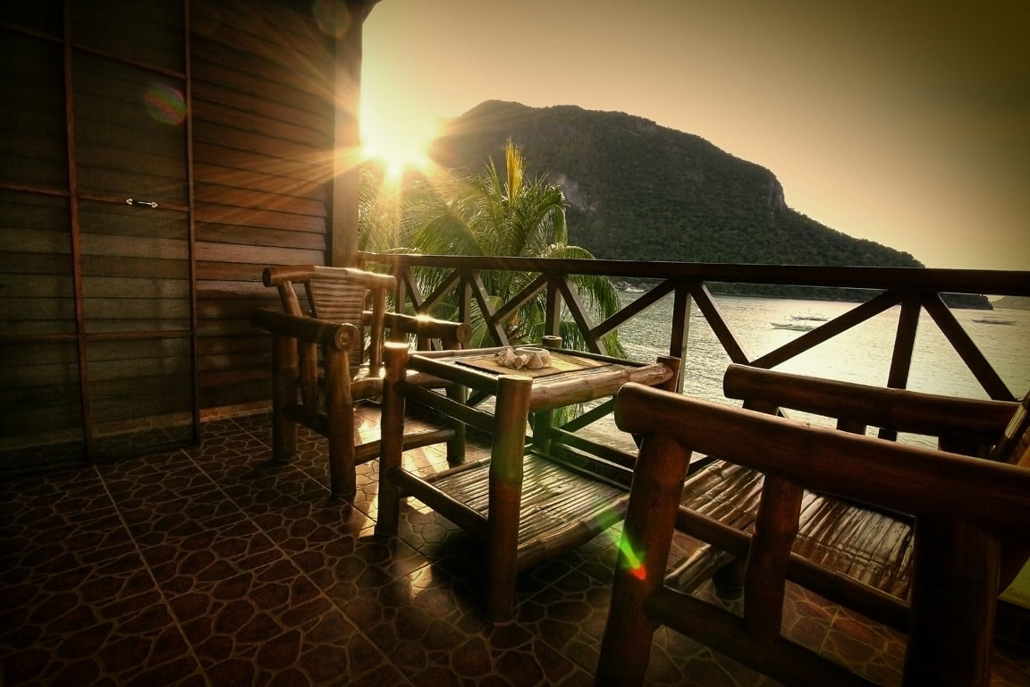 rectangular brown wooden table with four chairs dining set beach