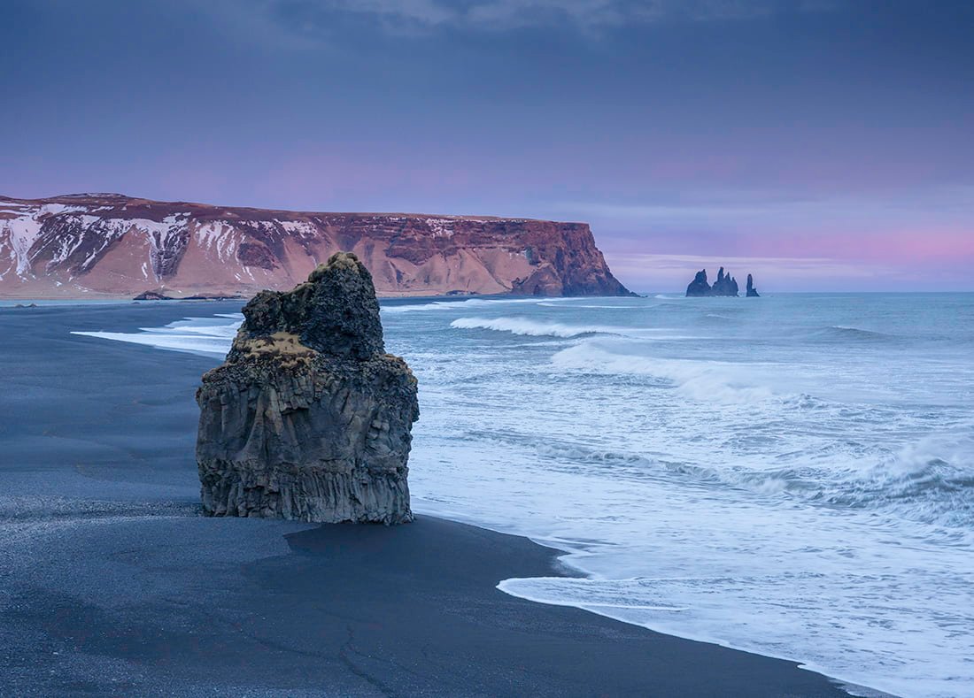 sea stock near shore under clear sky black beach iceland
