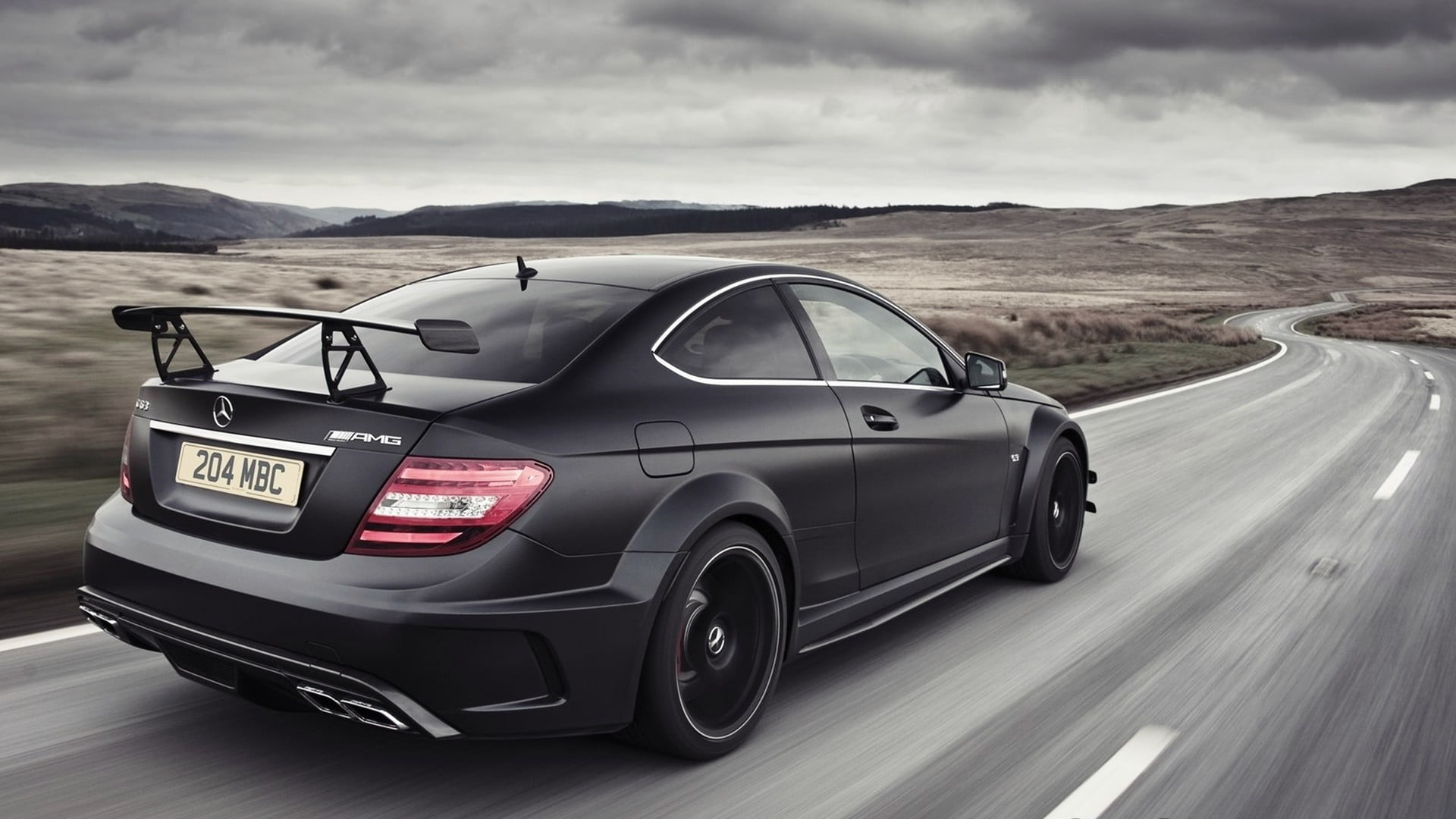 black Mercedes Benz coupe AMG car transportation 2k