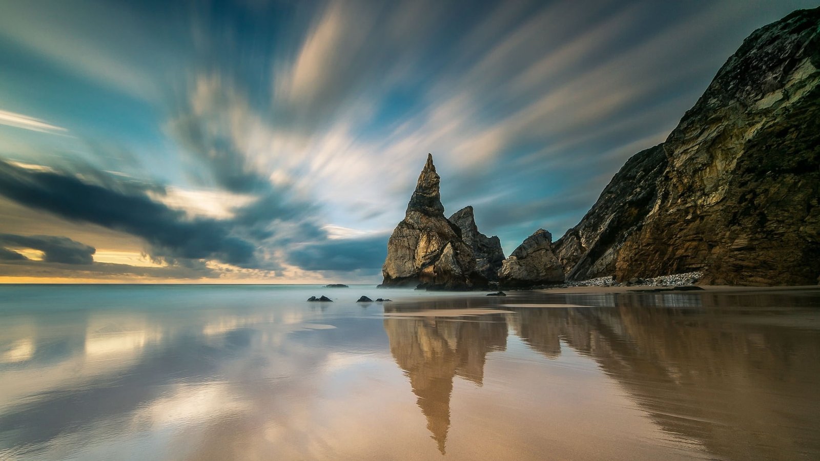 body of water and brown mountain nature landscape long exposure 2k