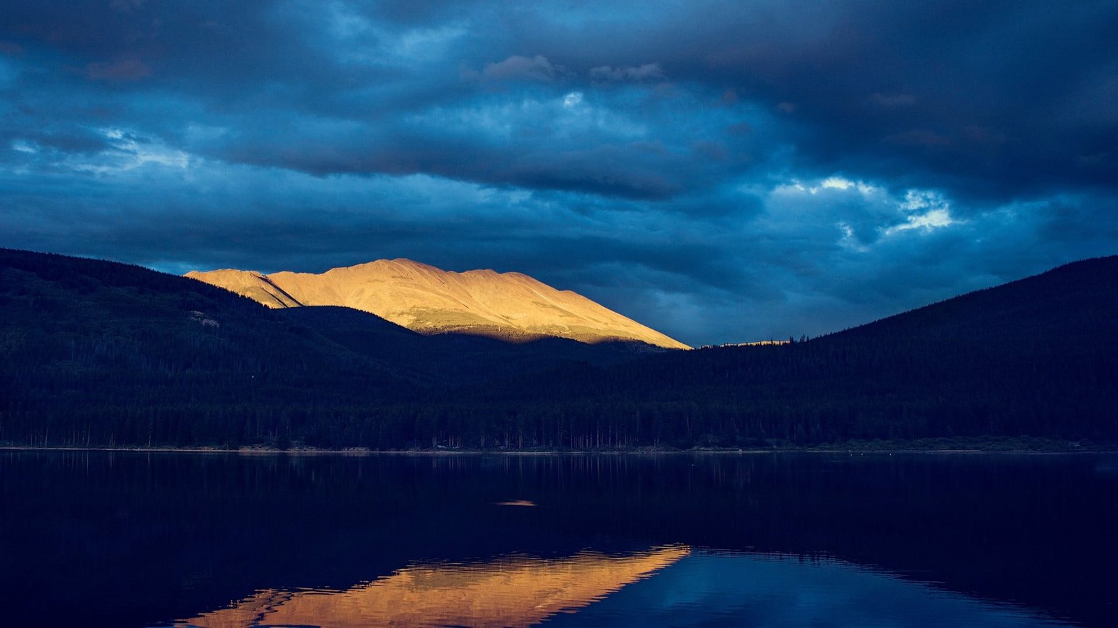 body of water near mountain nature landscape mountains clouds 2k