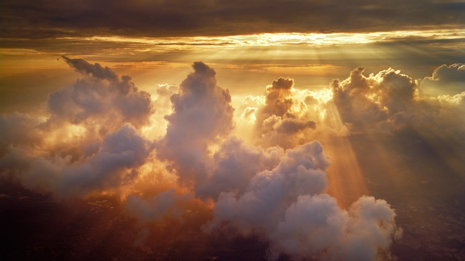 clouds under sunset nature sun rays sunlight aerial view 2k