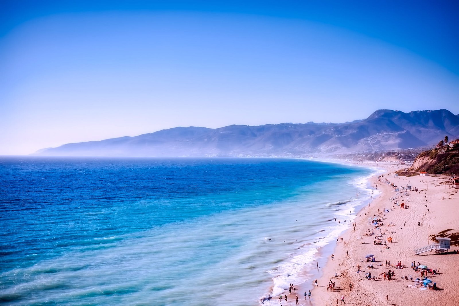 aerial photography of beach with crowded people Malibu California 2k