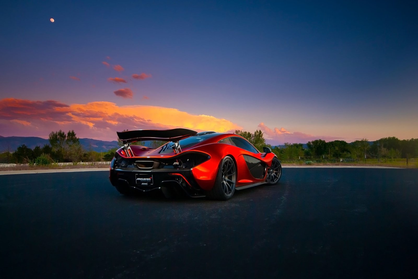 red and black sports car McLaren mode of transportation 2k