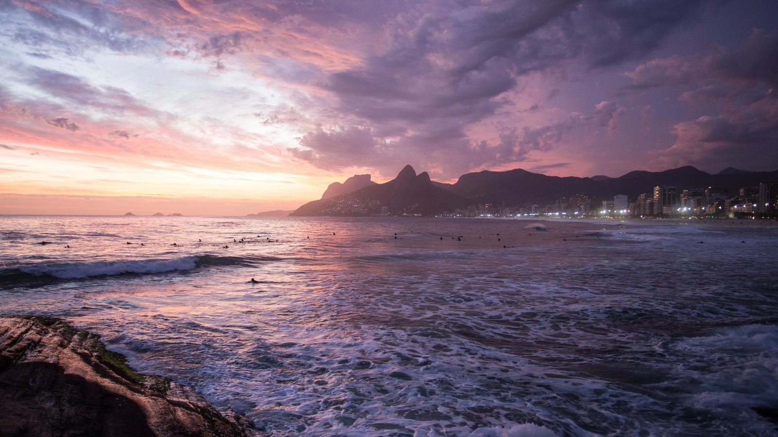 body of w Brazil Stone Arpoador beach sunset sky water 2k