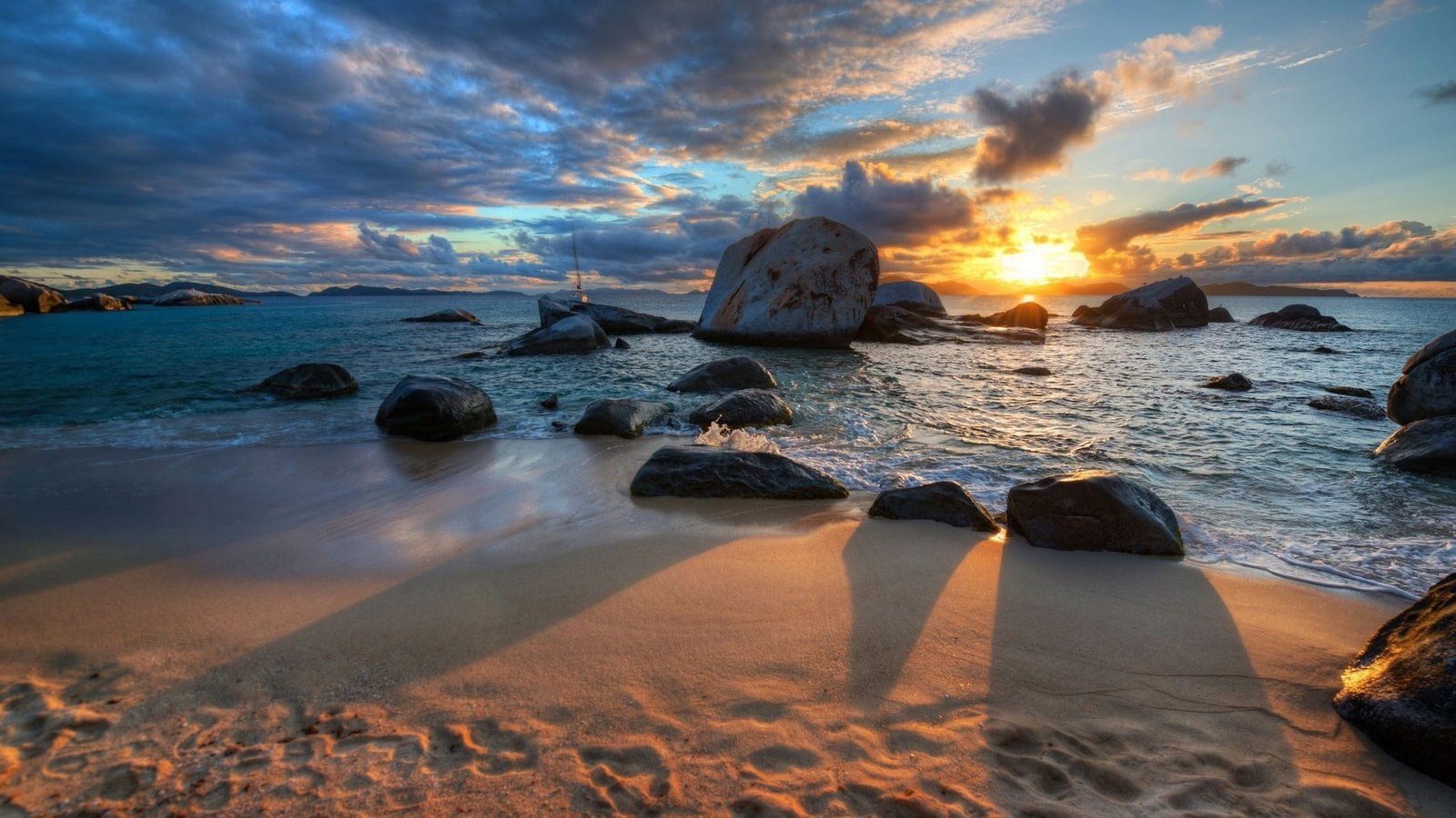 body of water near rock formation nature sea beach sunset 2k