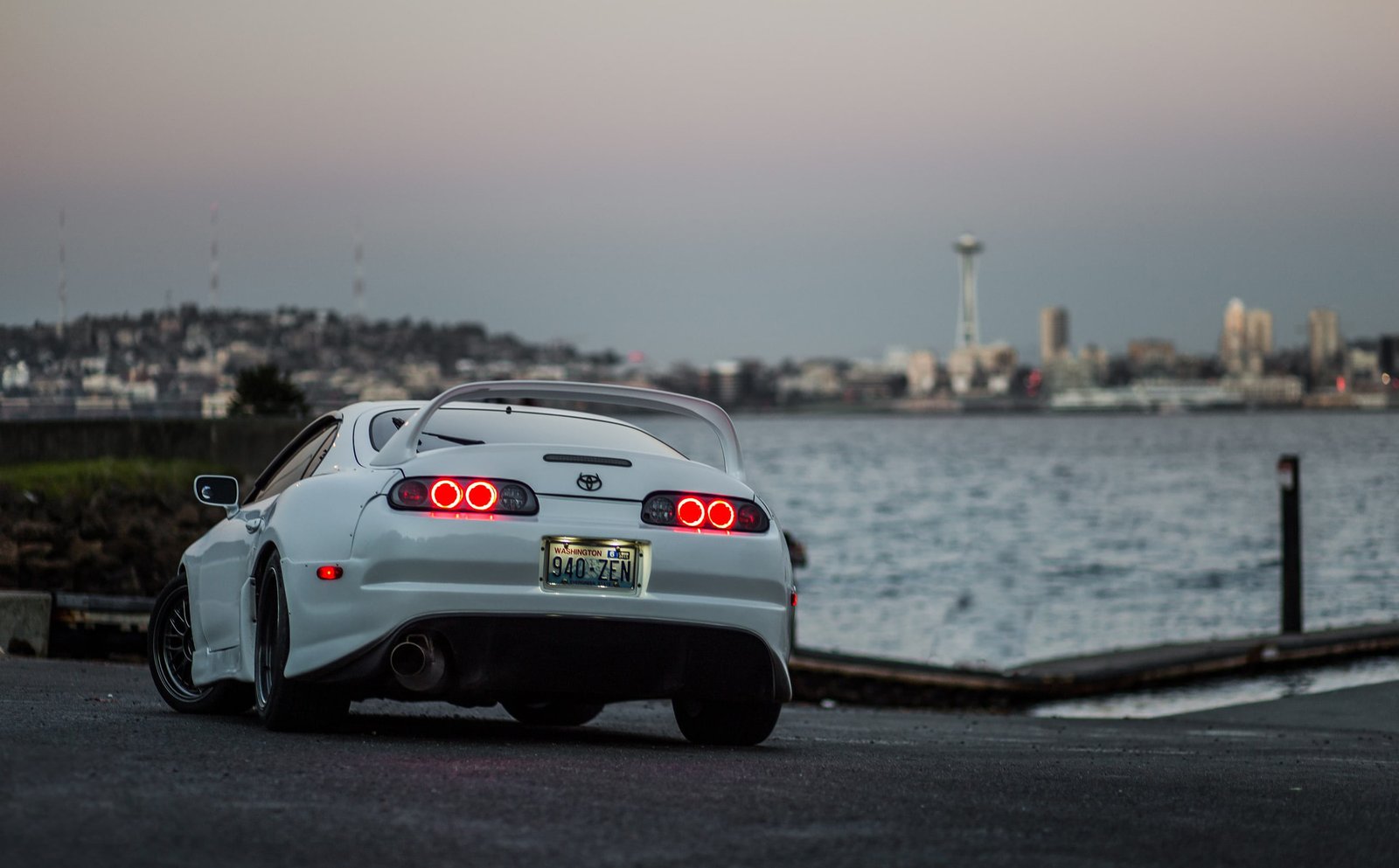 white Toyota Supra coupe Trial car transportation 2k