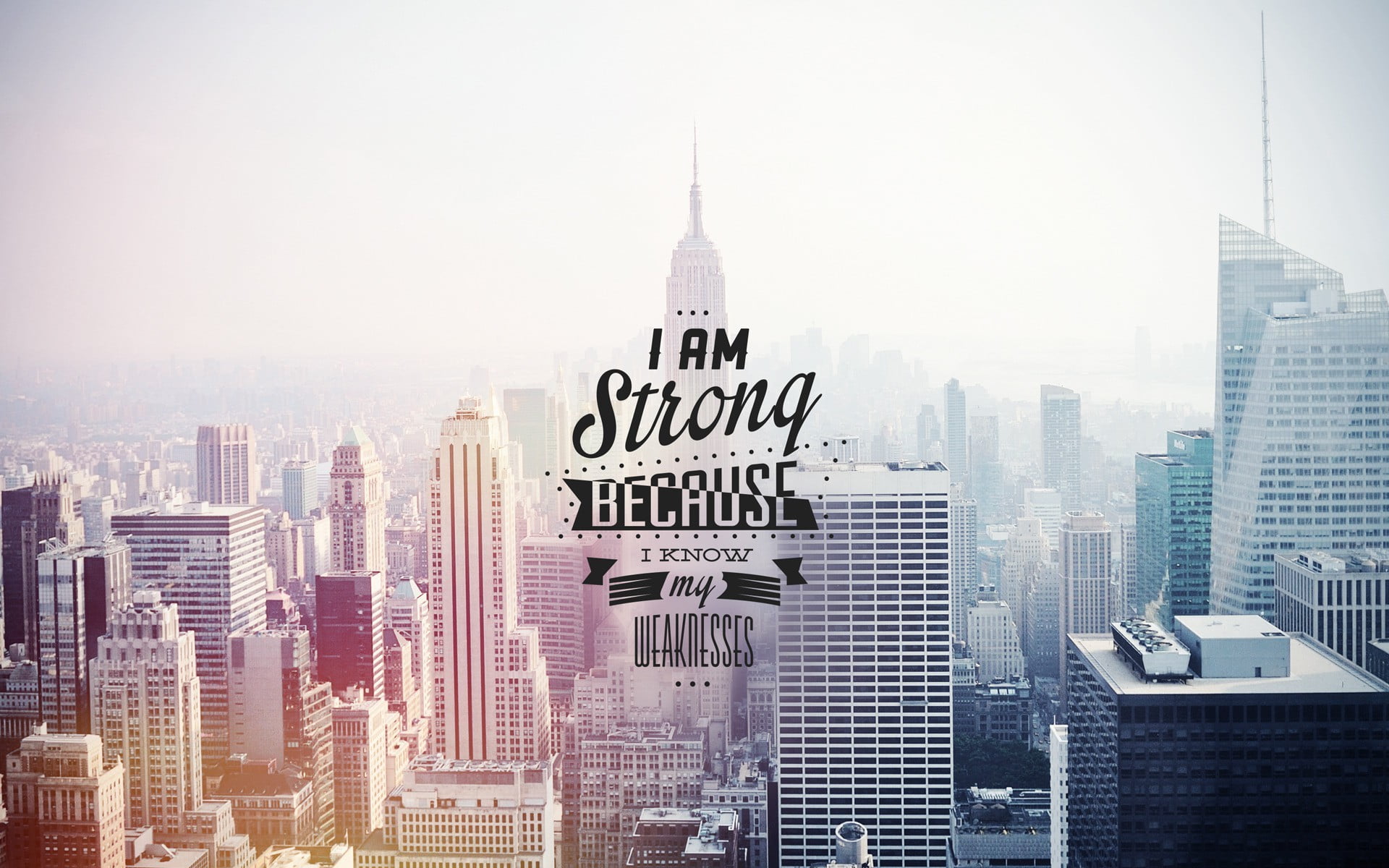 I am strong because know text i my weaknesses overlay on Empire State background 2k