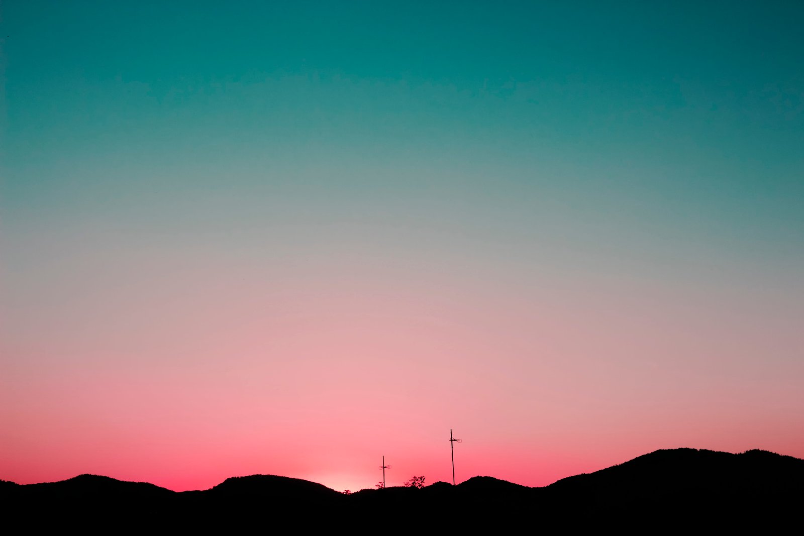 silhouette of mountains under pink and blue sky a mountain during orange sunset 2k 4k 5k