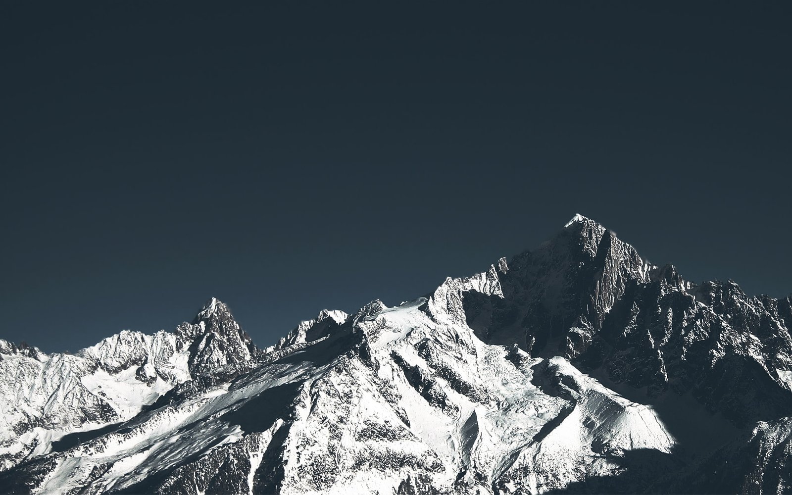 snow covered mountain mountains rocks clear sky nature cold temperature 2k