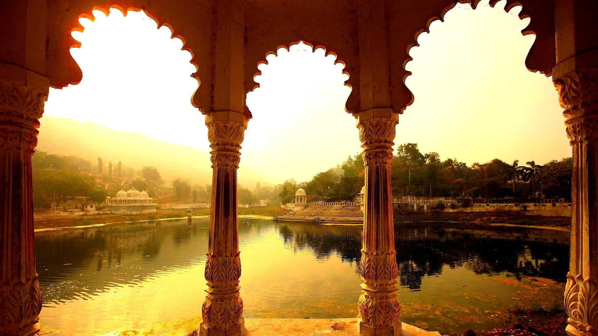 The Beauty Of Rajastan brown concrete temple; body of water 2k
