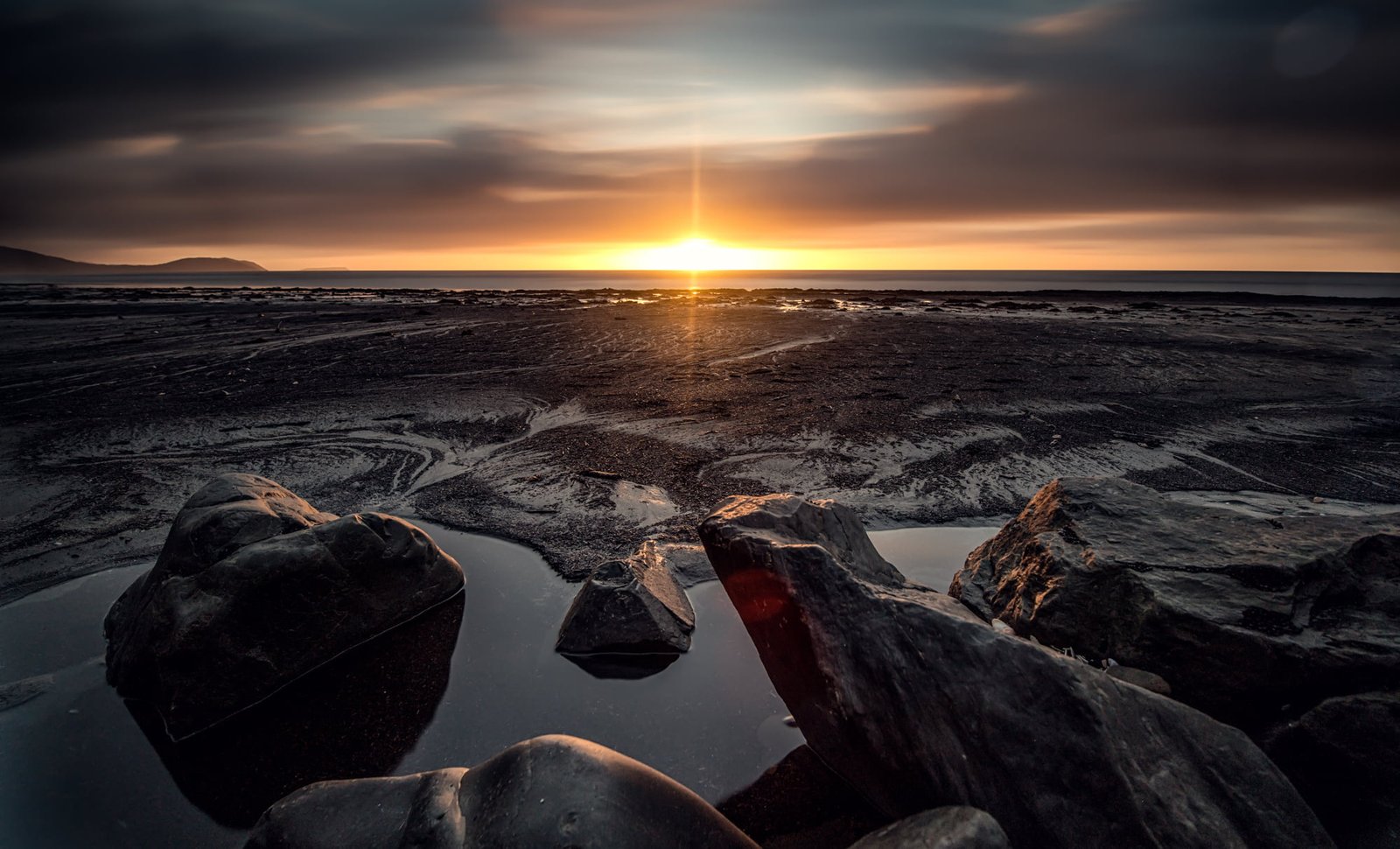 body of water landscape sunset sea beach rocks sky nature 2k