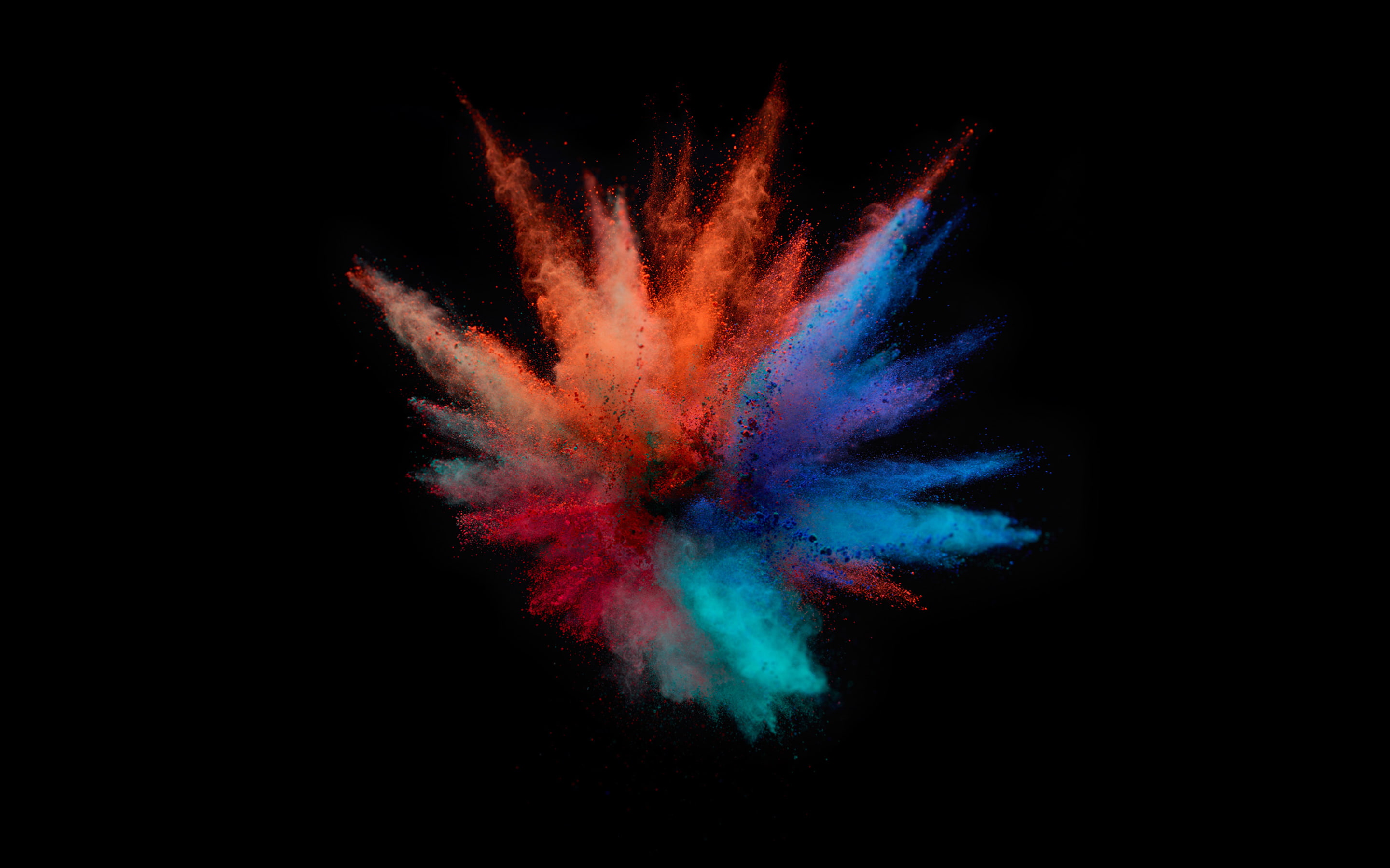 MacBook Pro Color Splash exploding black background studio shot 2k