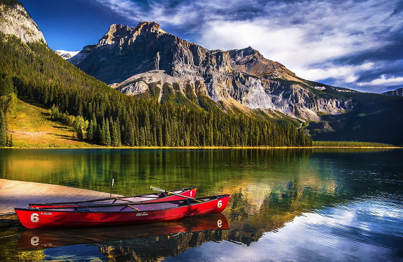 two red kayaks landscape nature lake mountains forest canoes