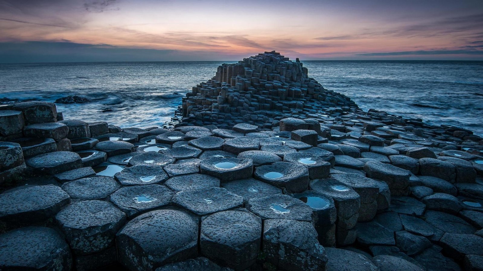 stone near water at night nature landscape horizon rock formation 2k