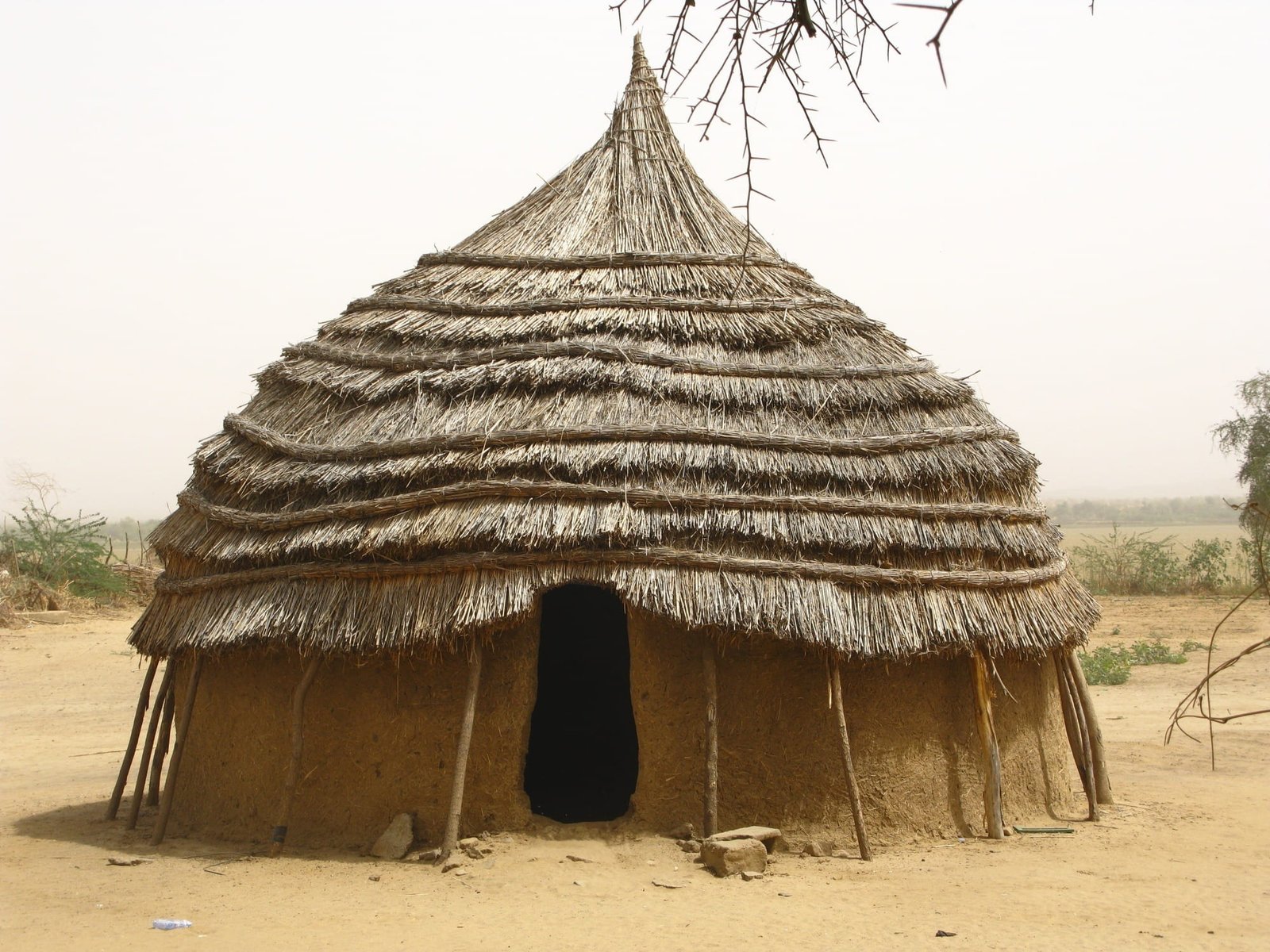 brown hut under white clouds during daytime niger africa home 2k