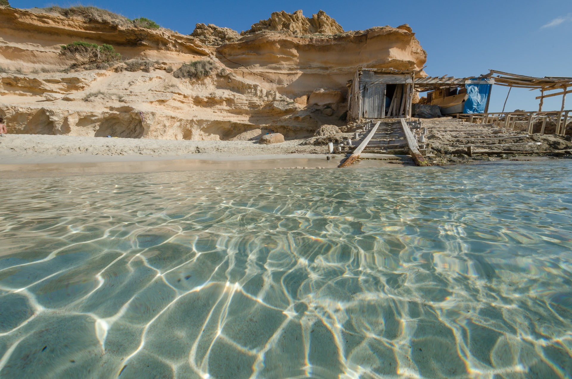 brown wooden house nature landscape beach Formentera balearic islands 2k