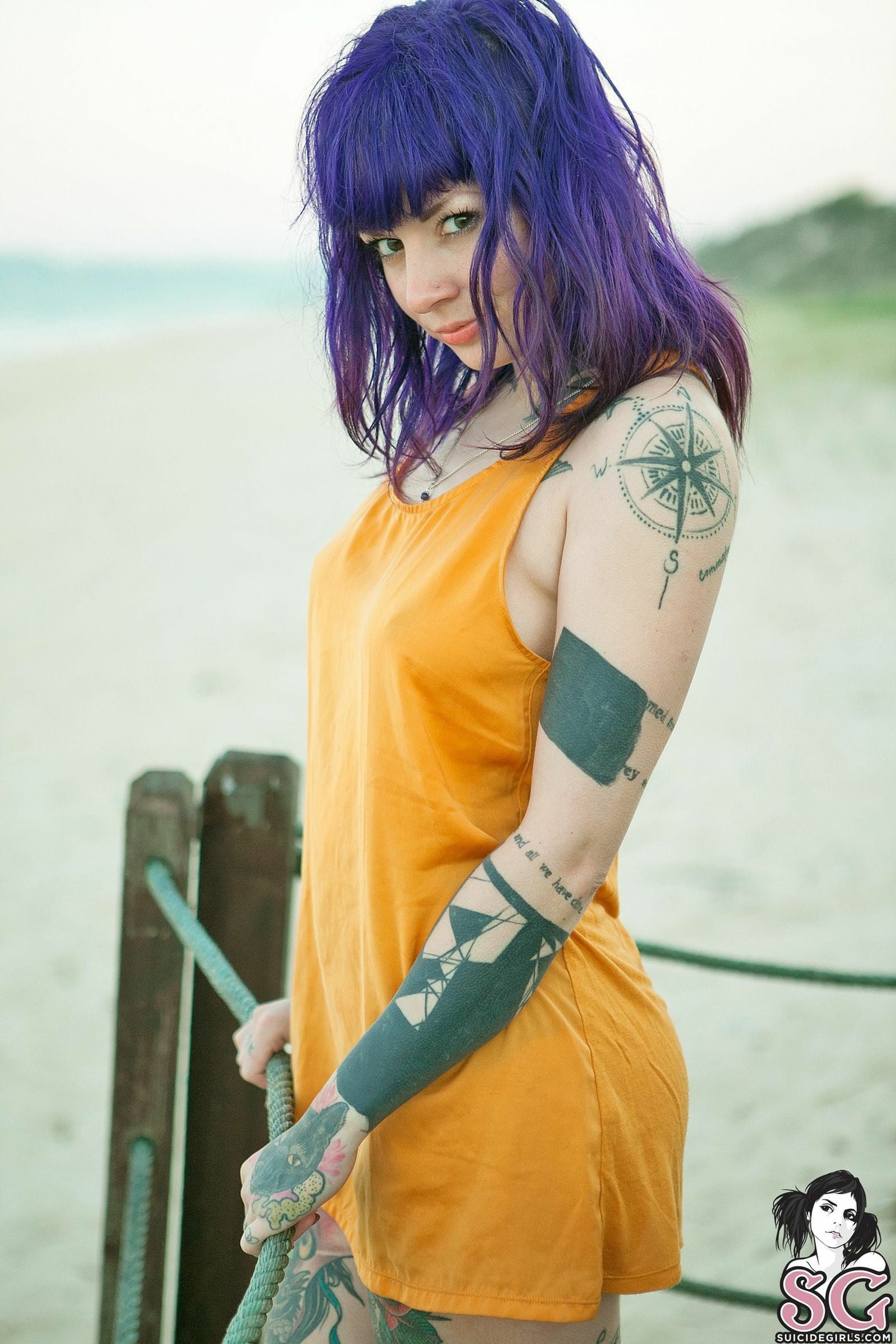 women's yellow tank top Katherine Suicide beach tattoo one person 2k