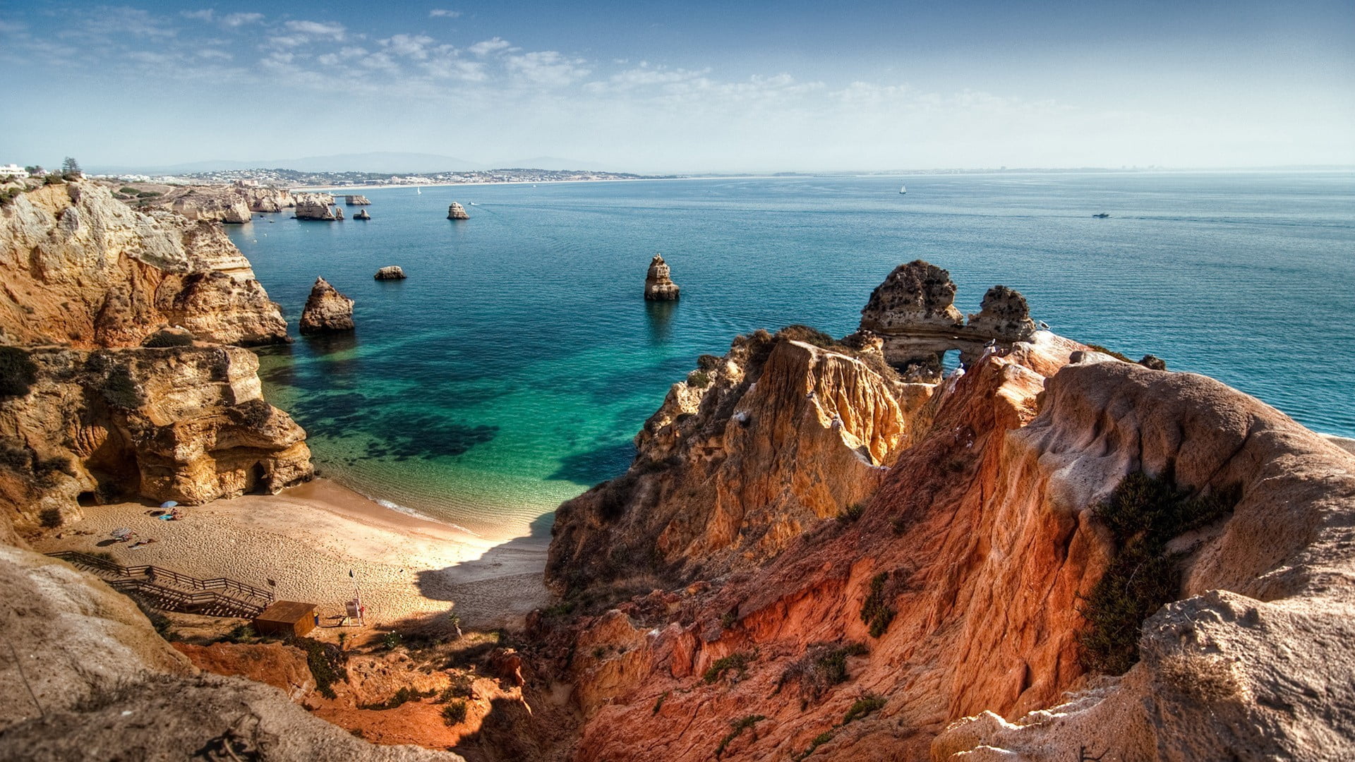 ocean and brown mountains beach rock sea praia do camilo 2k