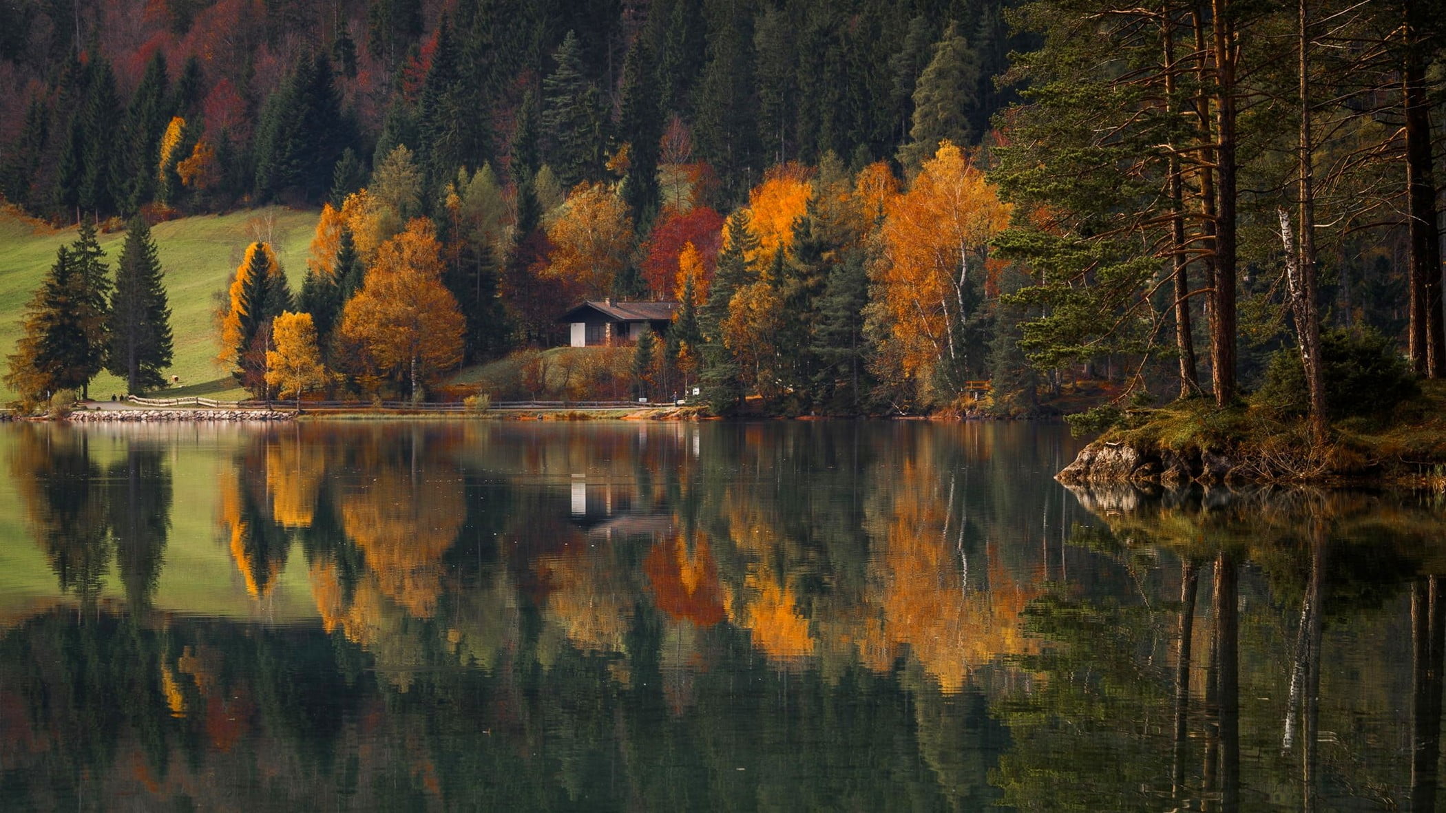 brown wooden cabin in near lake reflective shot landscape 2k