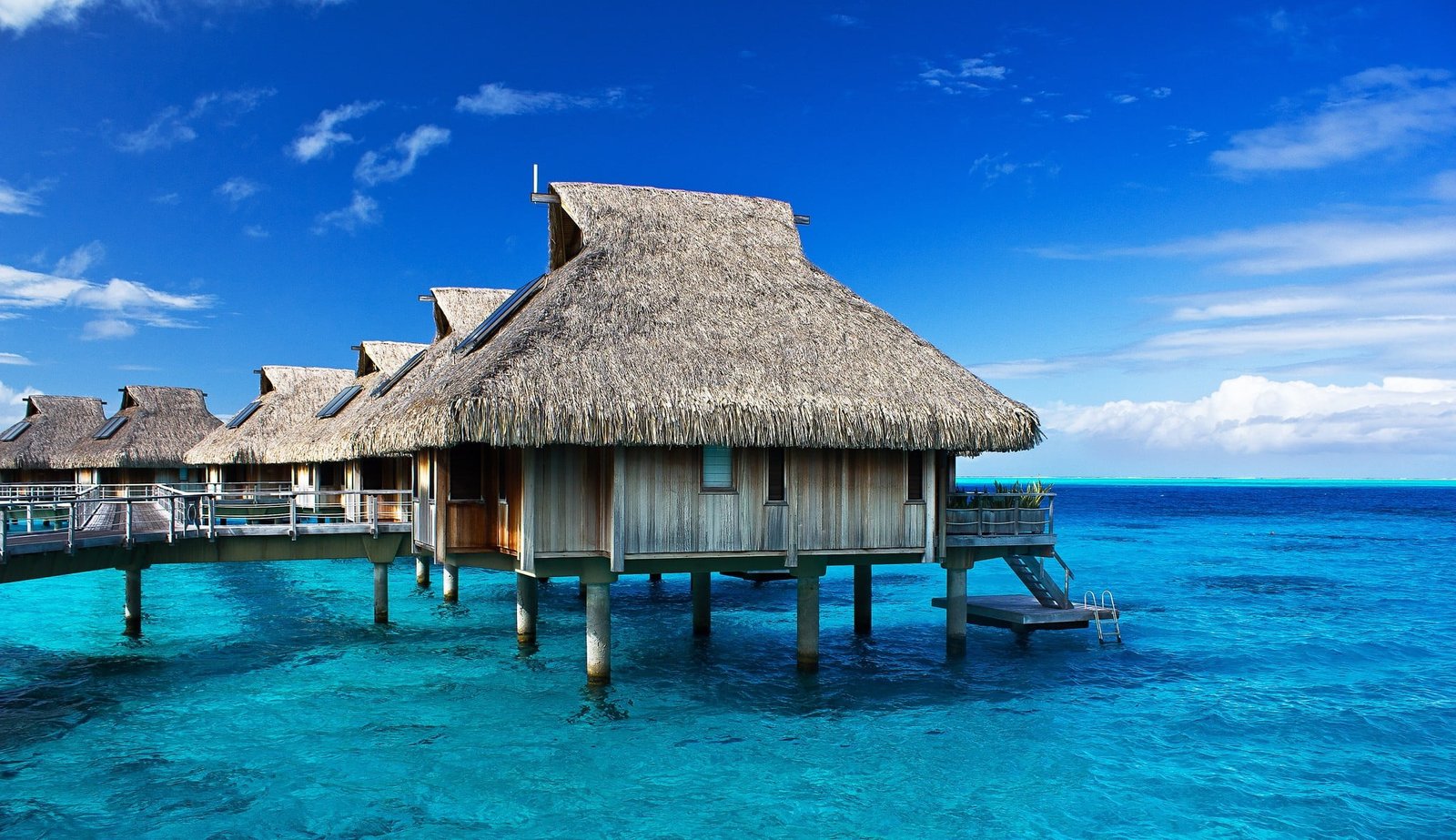 beige wooden huts landscape nature photography resort bungalow 2k