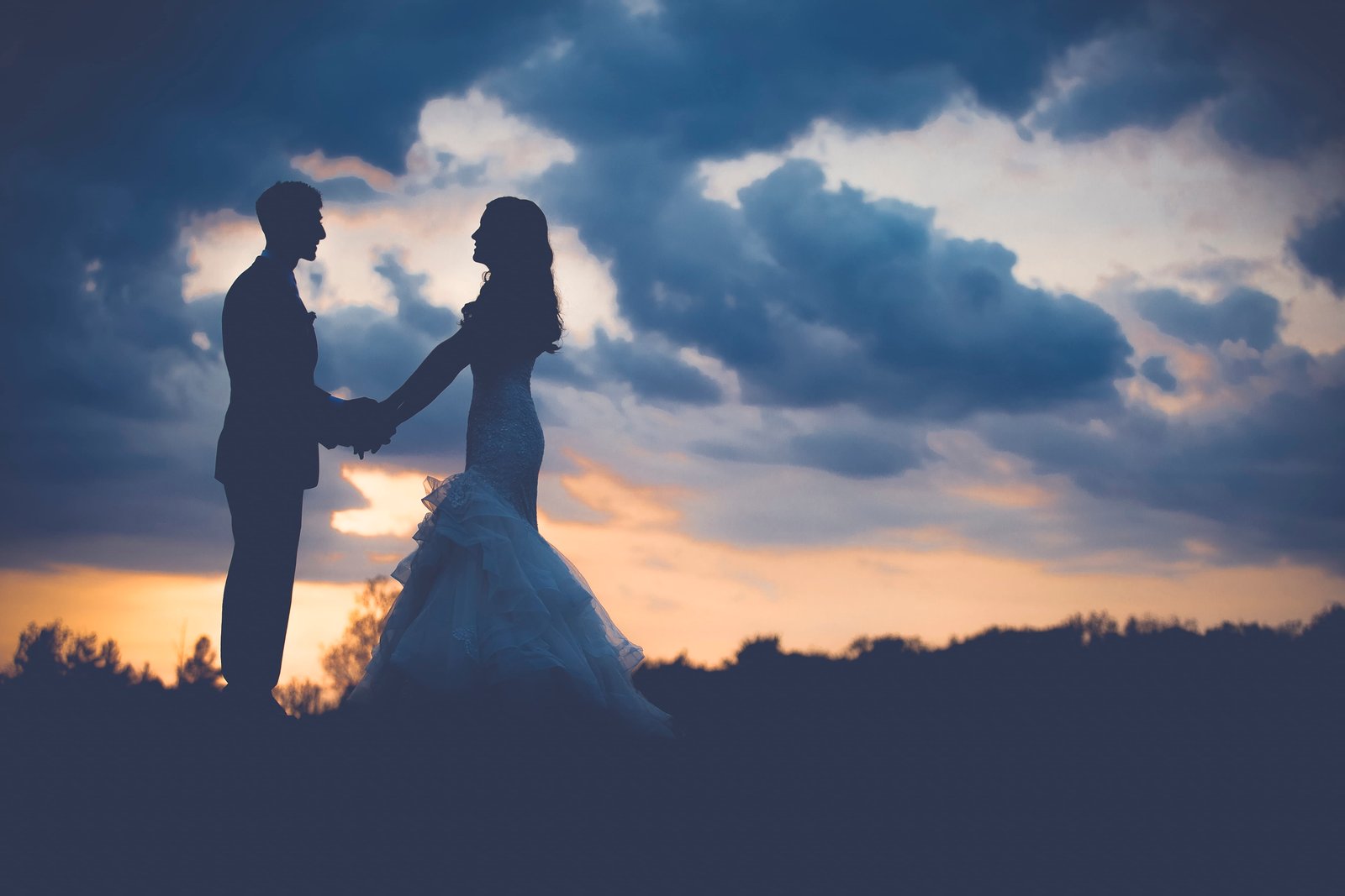 silhouette of wedding couple during sunset man and woman standing 2k 4k 5k