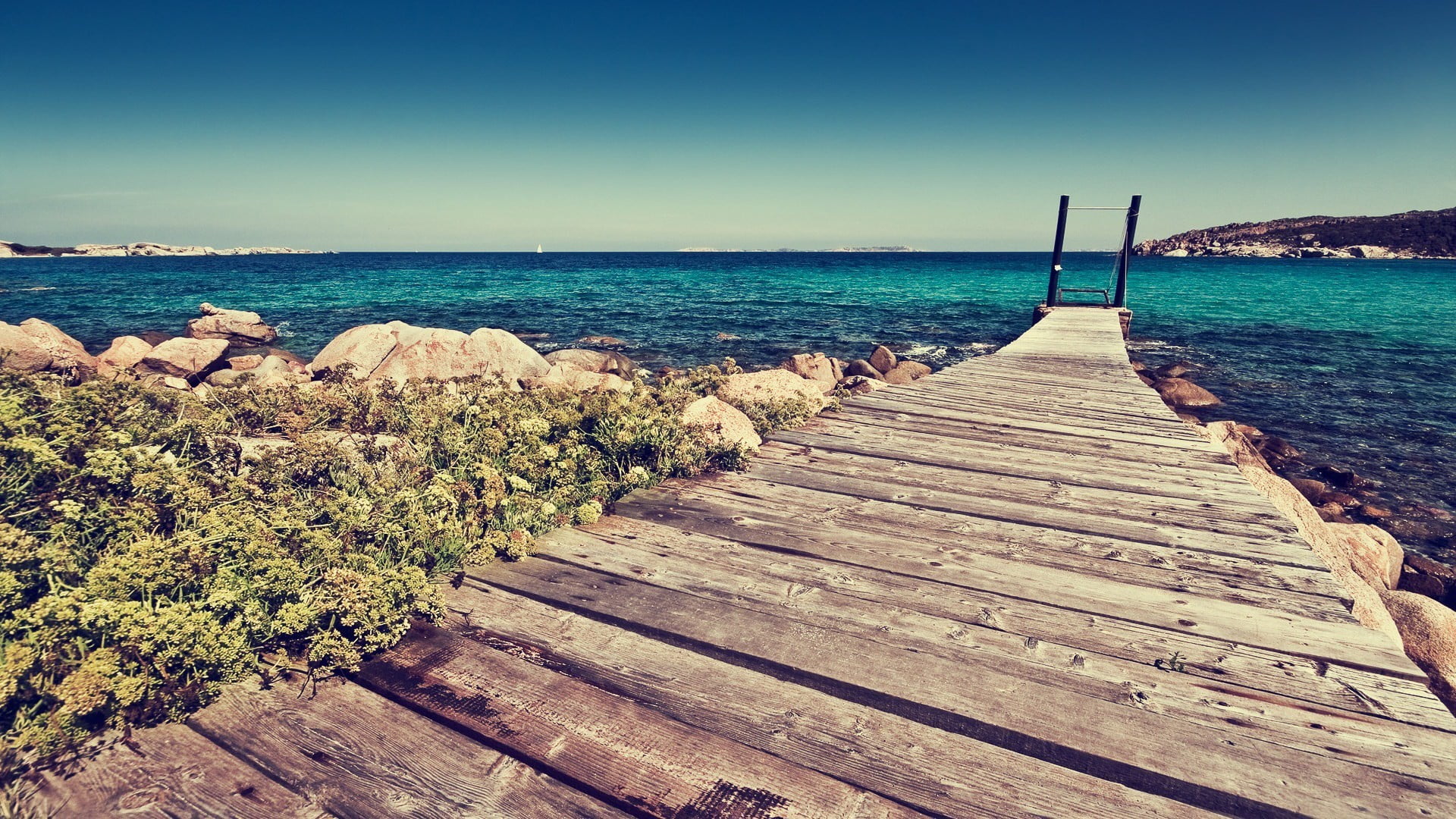 brown wooden dock nature beach rock sea water sky horizon over 2k