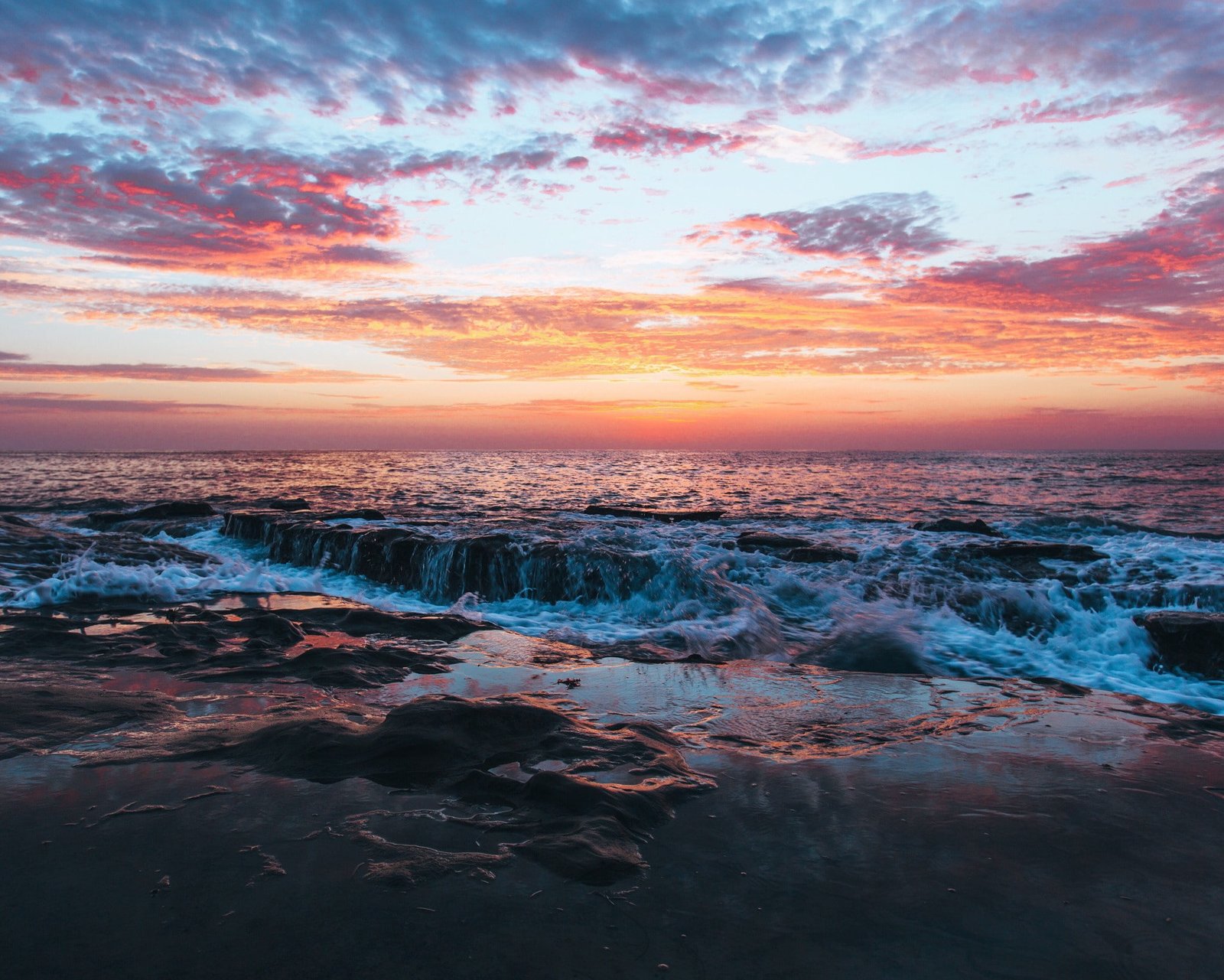 sea rock waves sunset beach clouds 2k