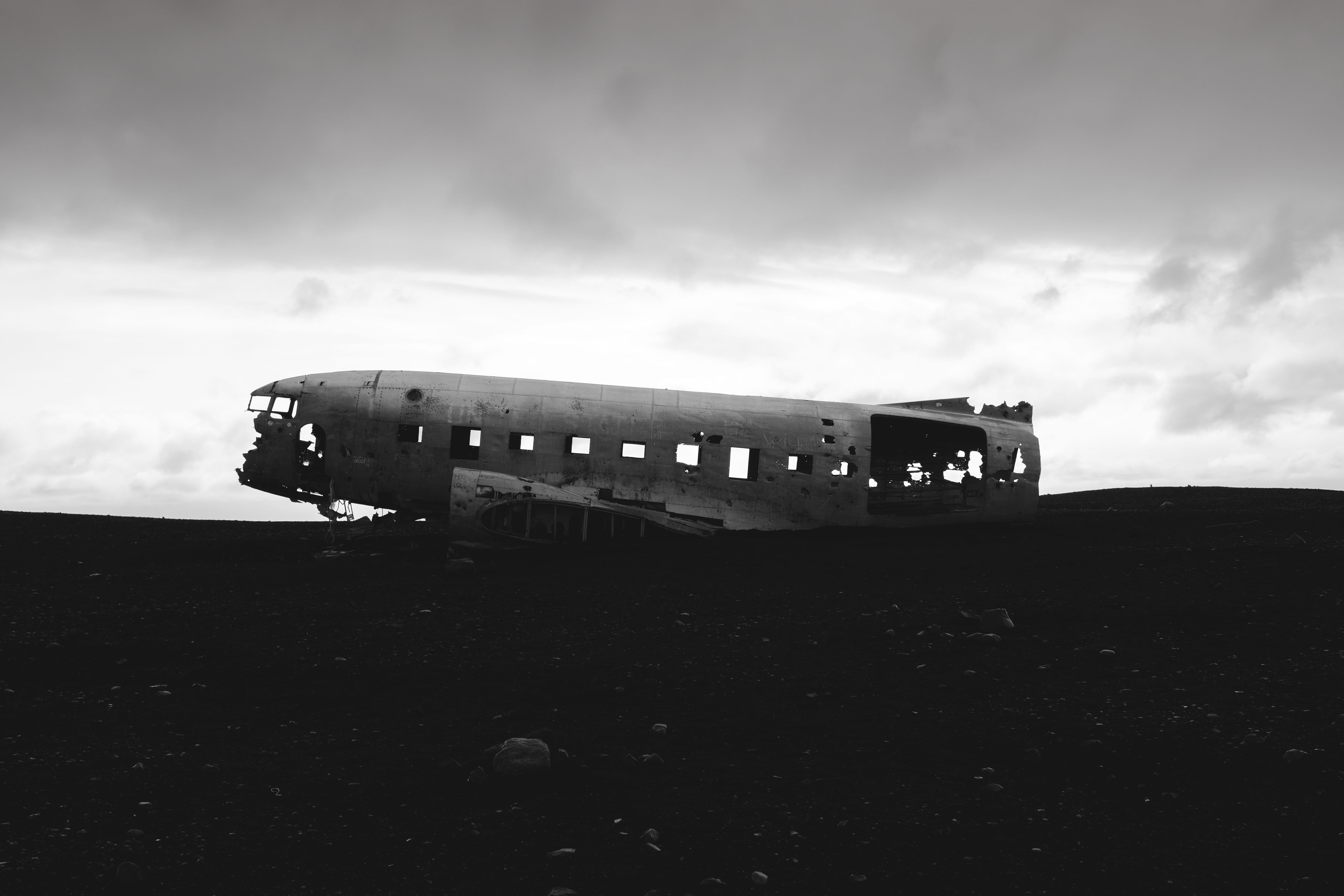 grayscale photography of wrecked plane iceland s lheimasandur 2k 4k 5k