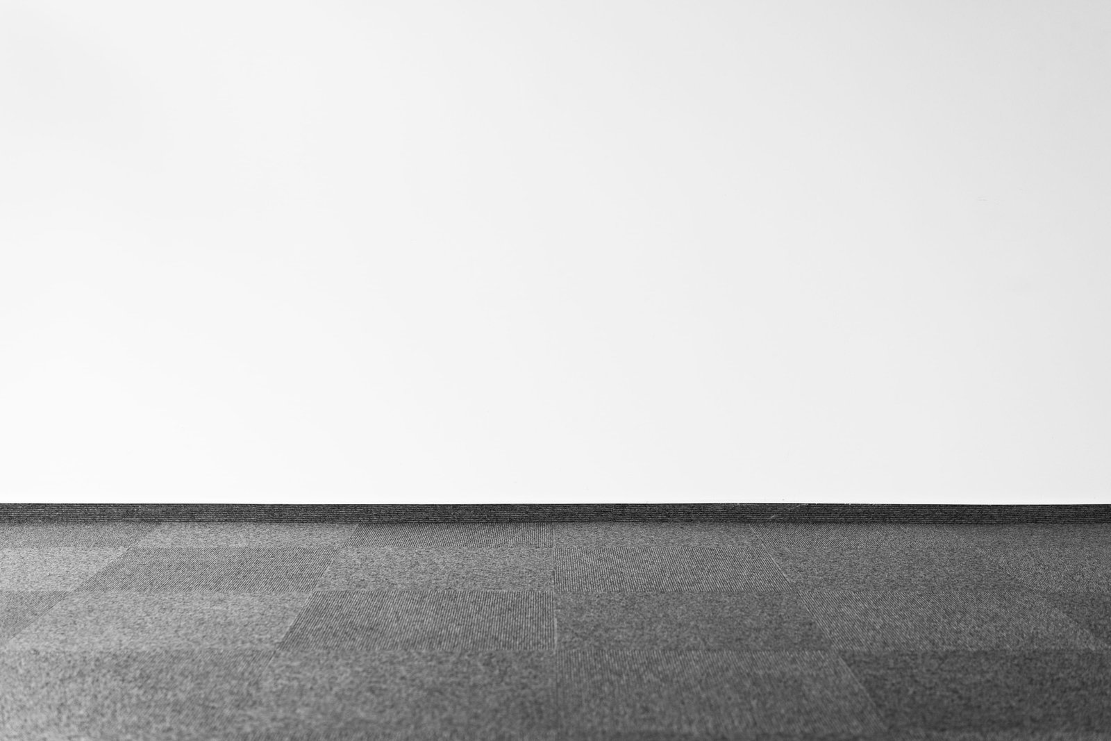 Gray Carpet and White Wall with Room for Text black white 2k 4k