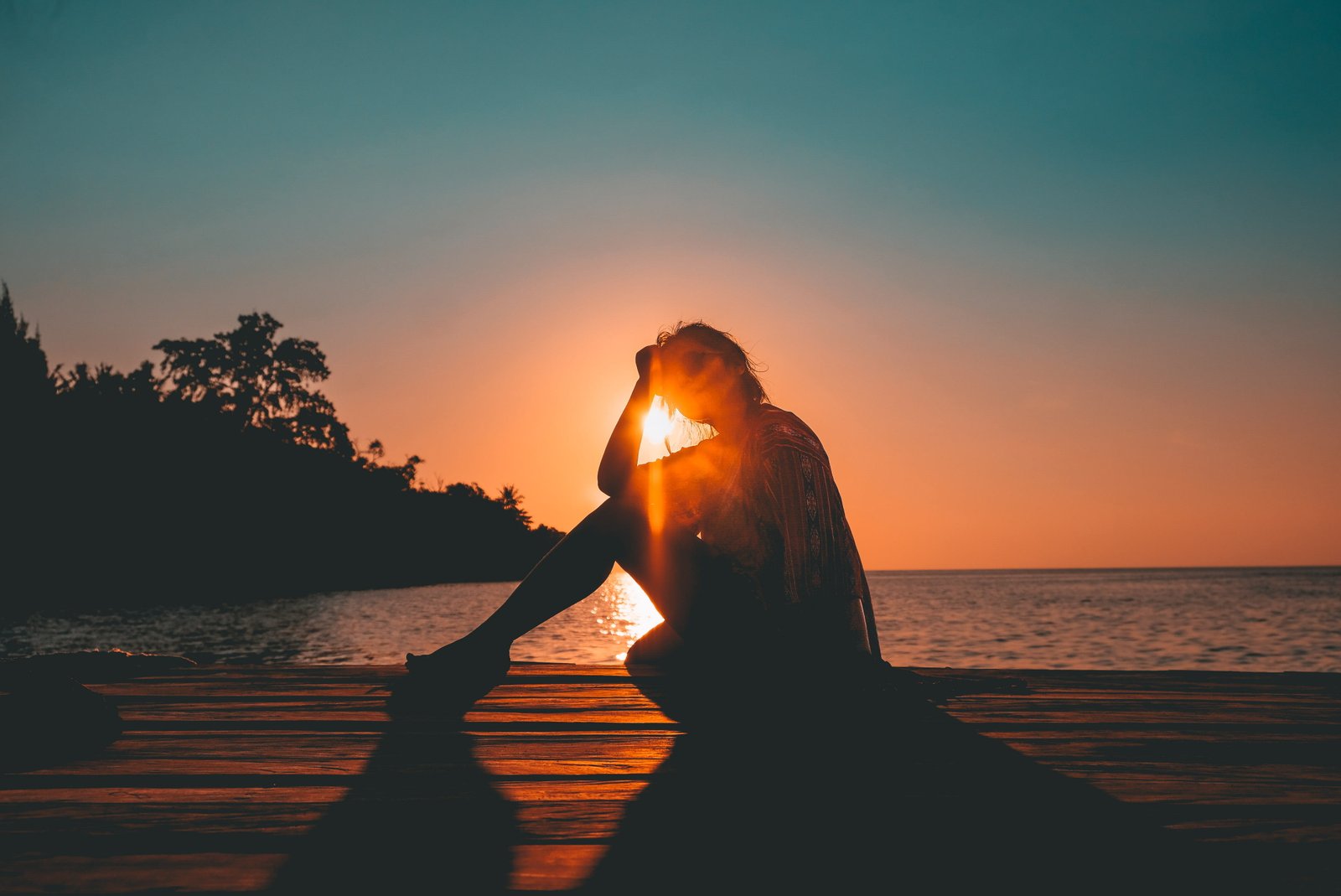 silhouette of woman photo person sitting on beach 2k 4k