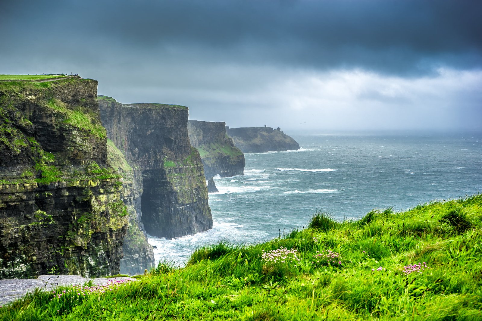 green grass covered mountain liscannor ireland 2k