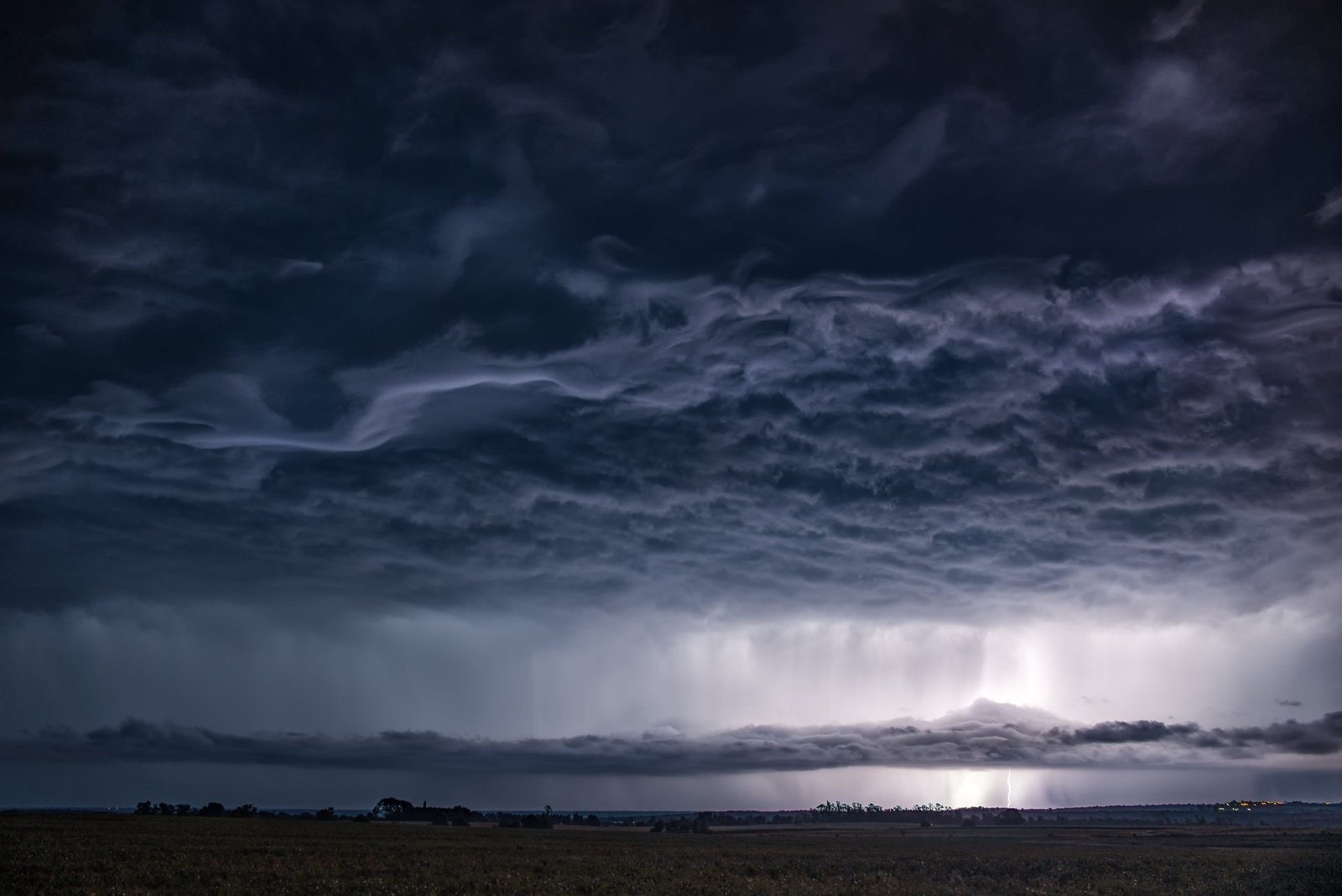 panoramic landscape photography of nimbus clouds over island beside river 2k 4k 5k