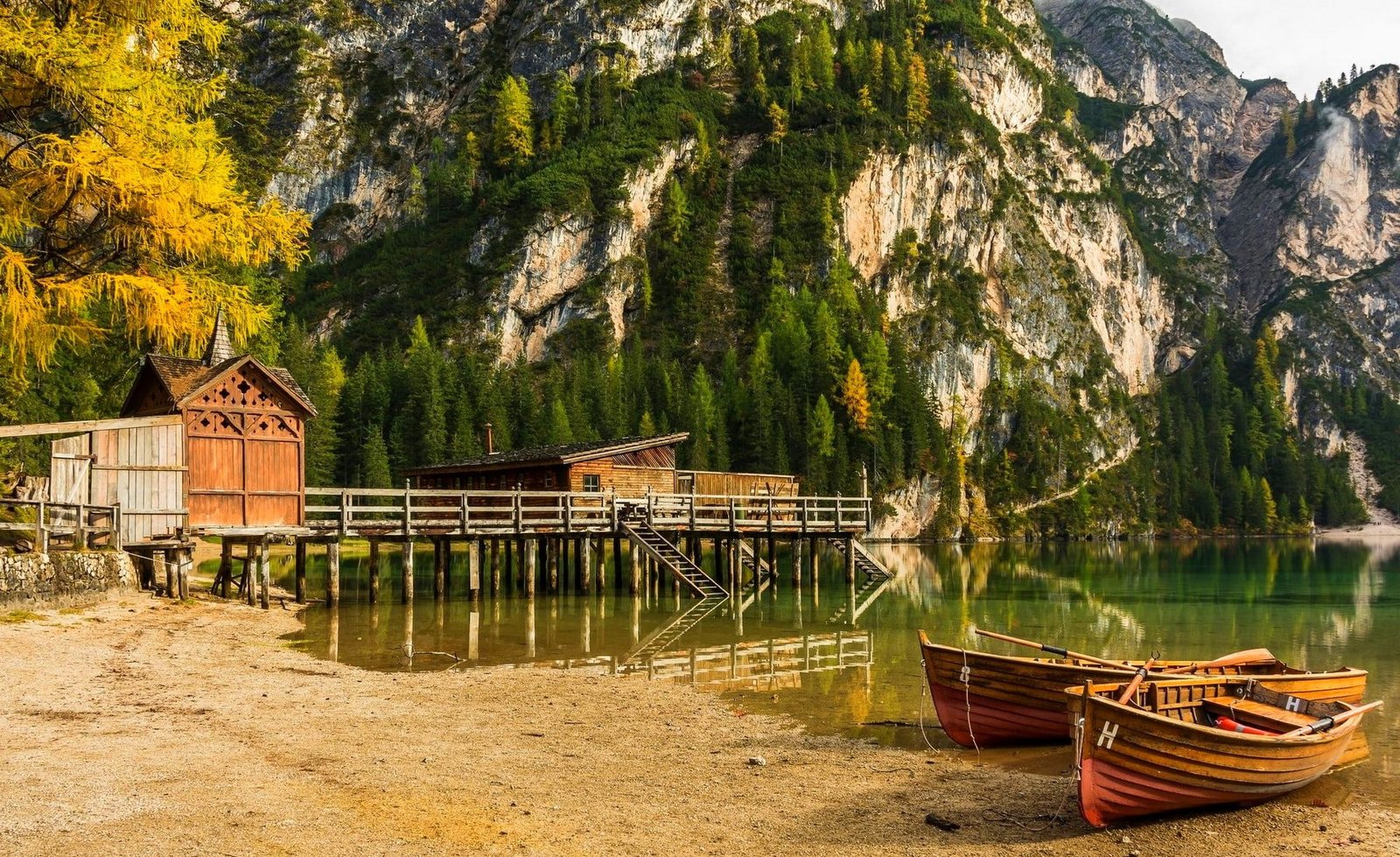 boat dock lake mountains beach forest cliff Alps trees 2k