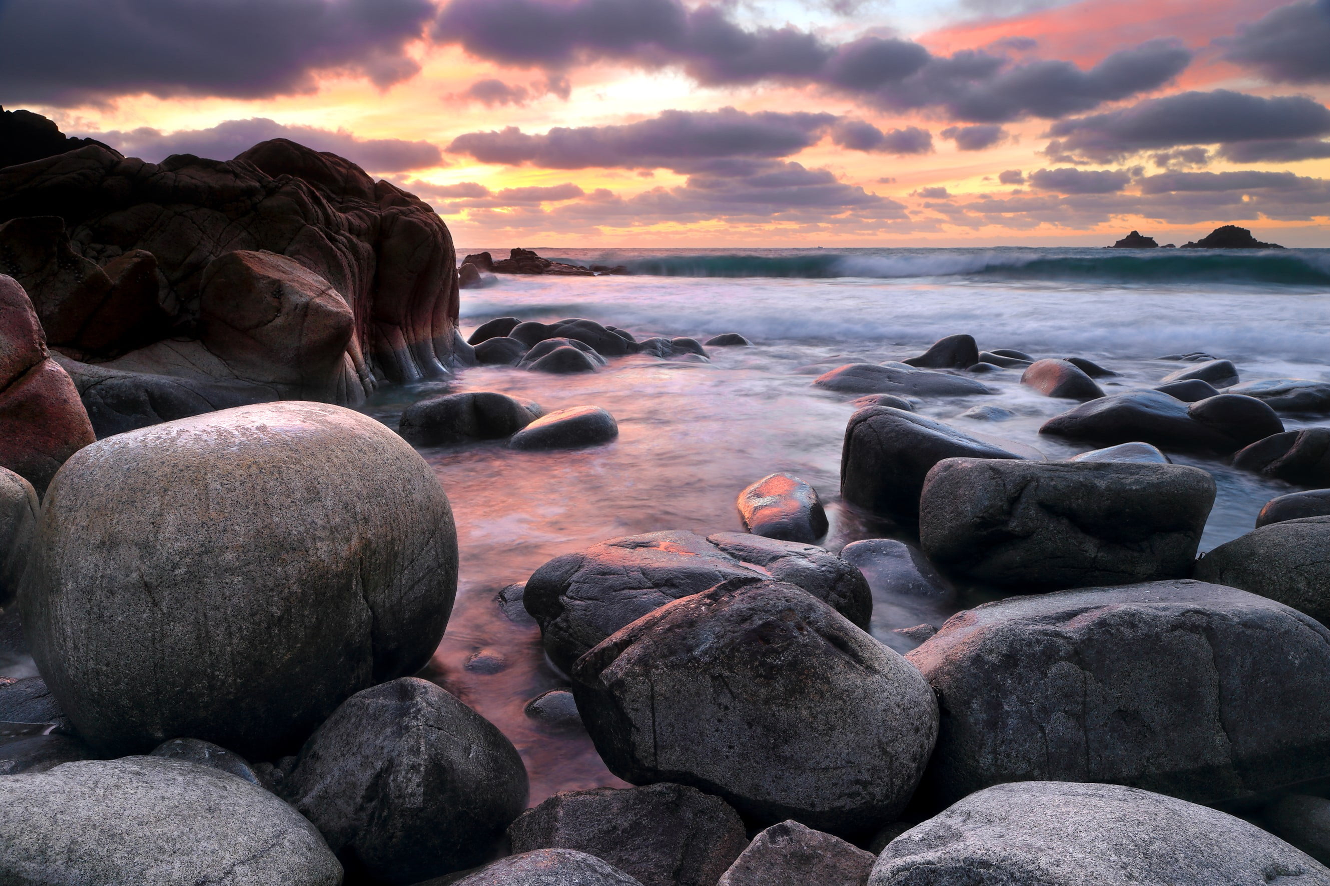 gray stone sea shore in sunset i Porth Nanven seascape Cornwall 2k