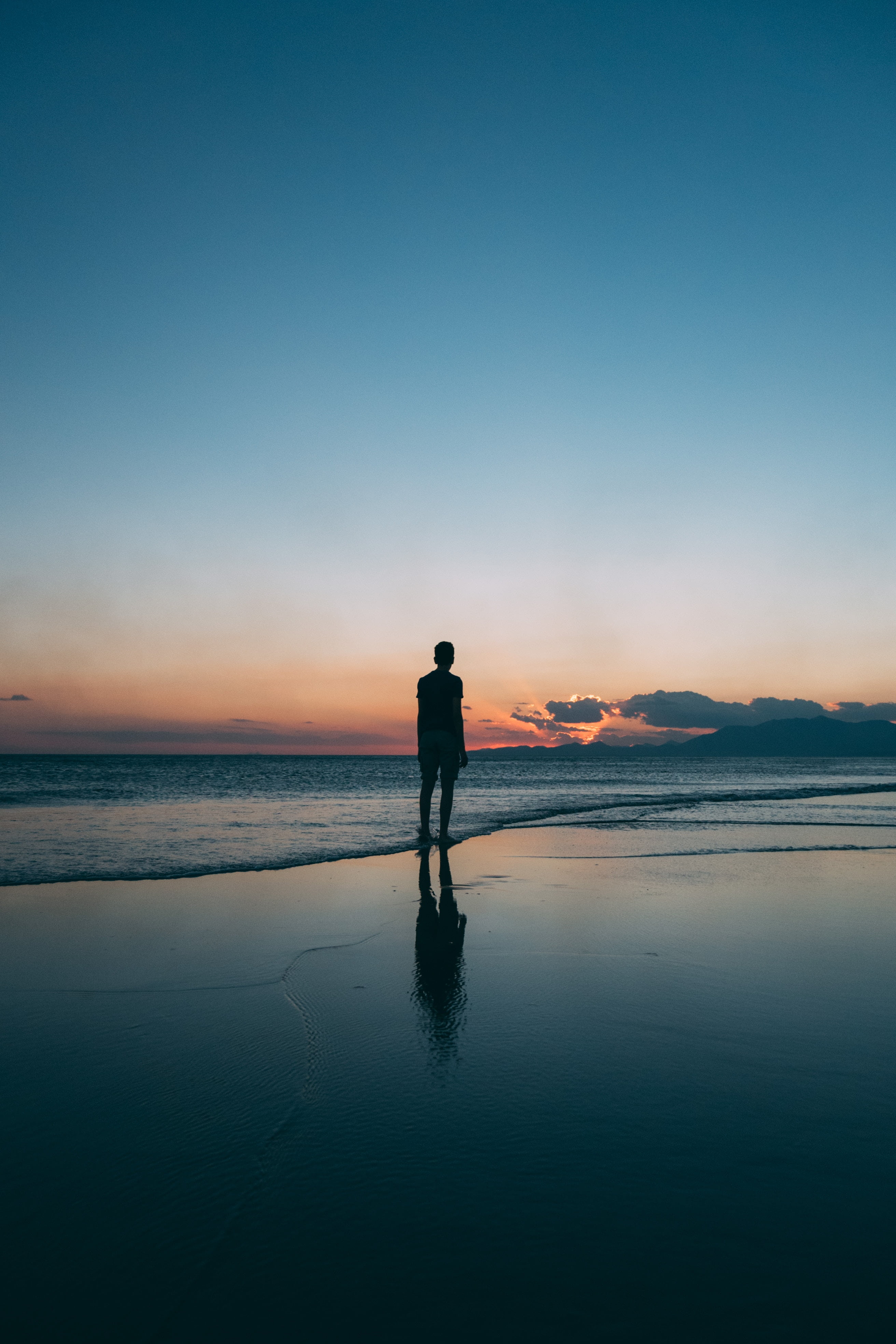 beach man silhouette sea shore surf sky real people water 2k