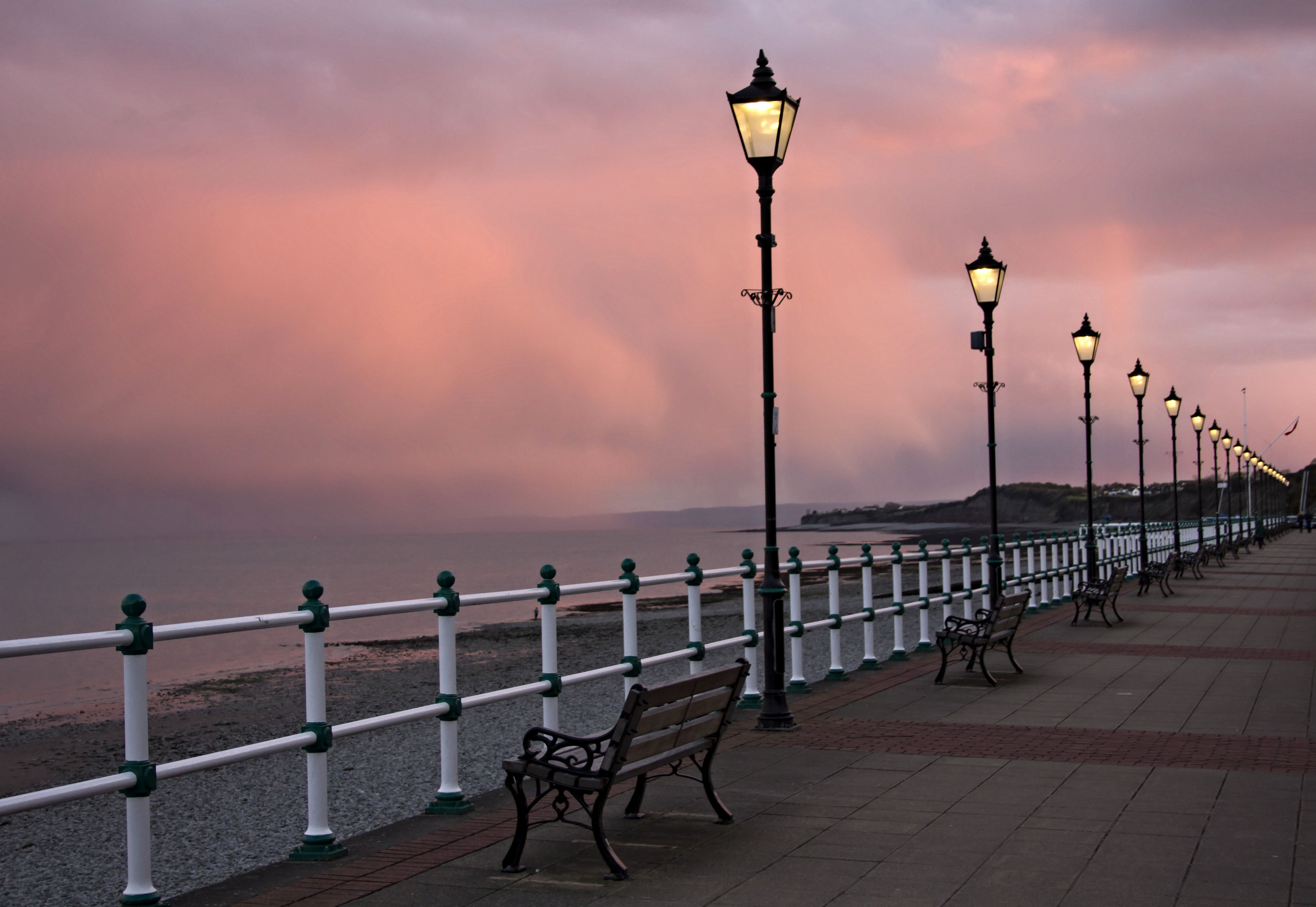 brown wooden bench near ocean penarth Sunset yr ym 2k 4k 5k