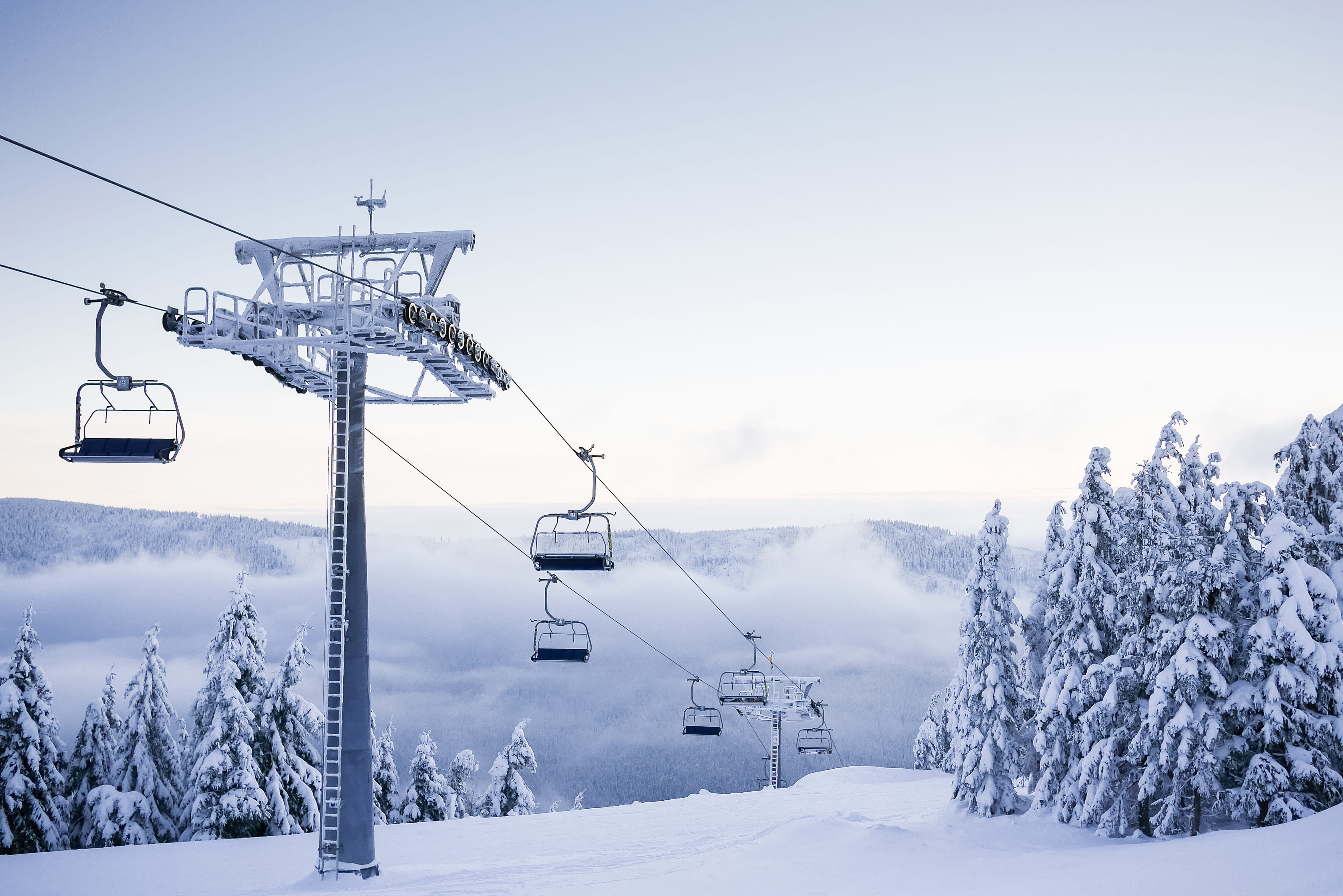 Empty Chair Ski Lift on Bright Winter Day cold fog foggy forest 2k 4k