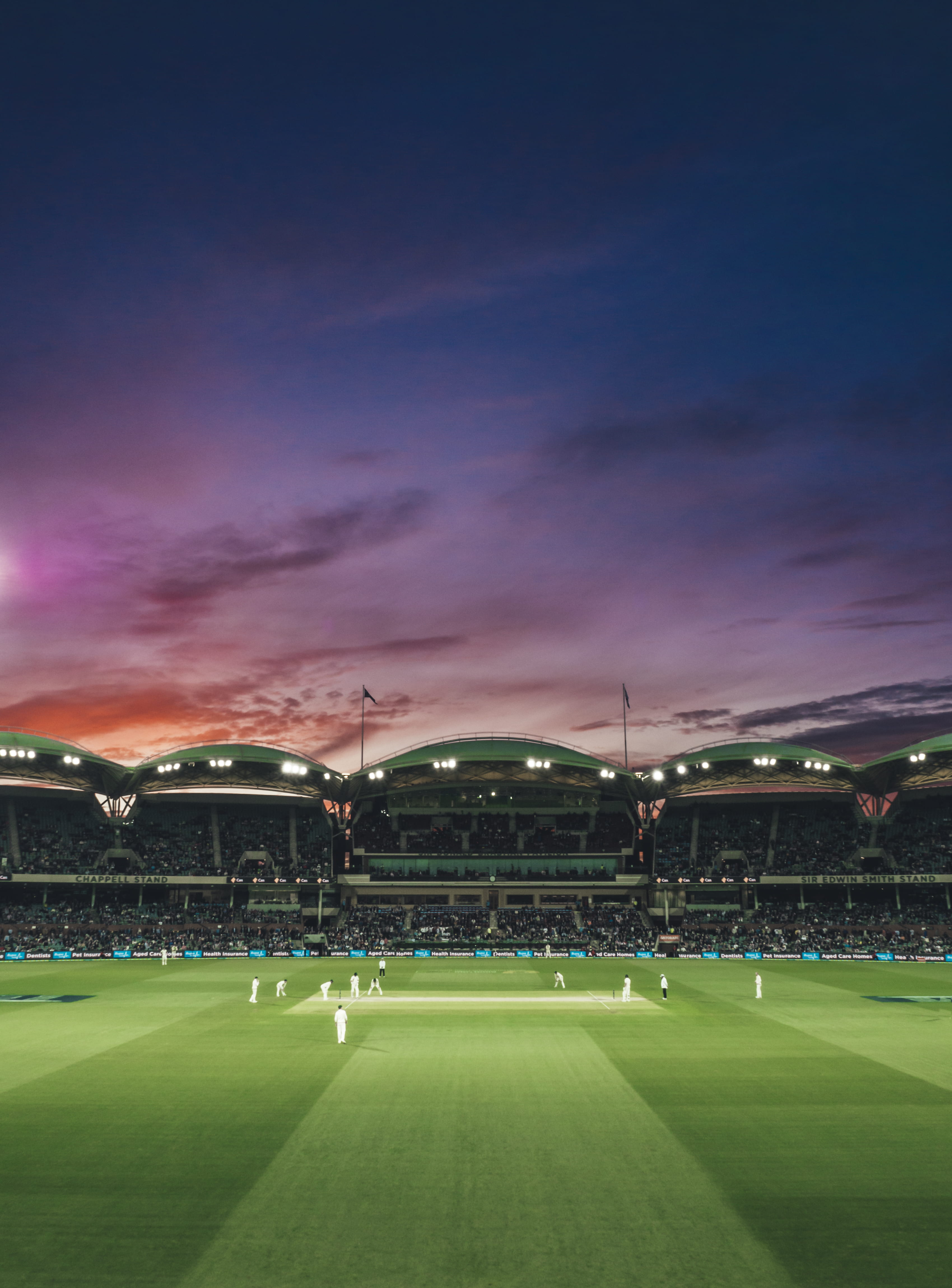 people watching game of cricket during sunset photography soccer field 2k