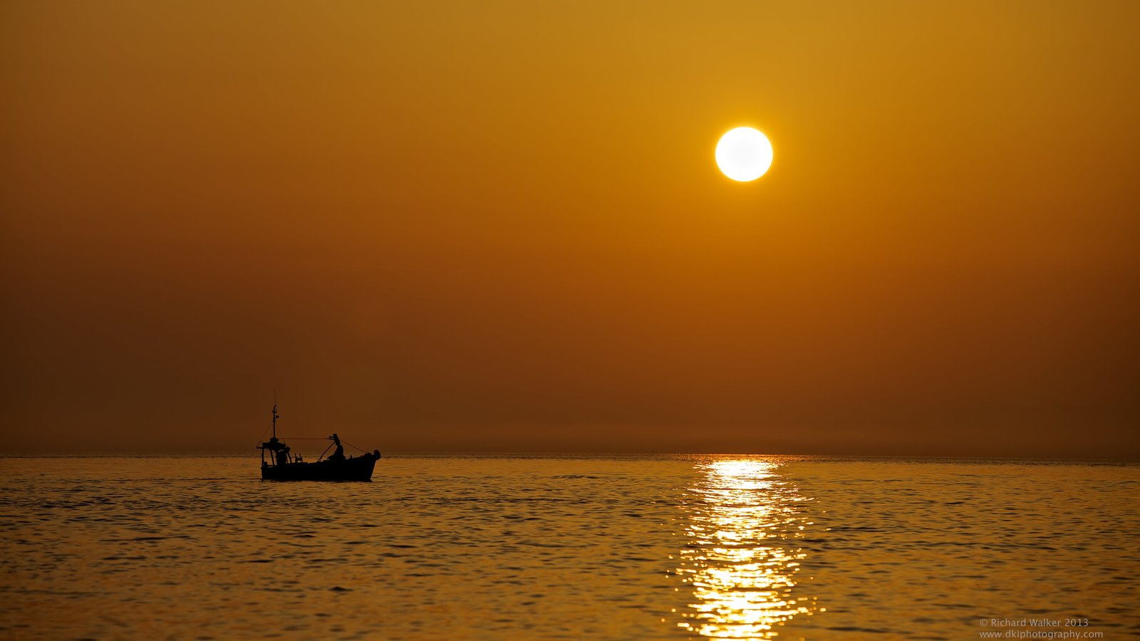 silhouette of boat on sea during golden hour st ives 2k 4k 5k