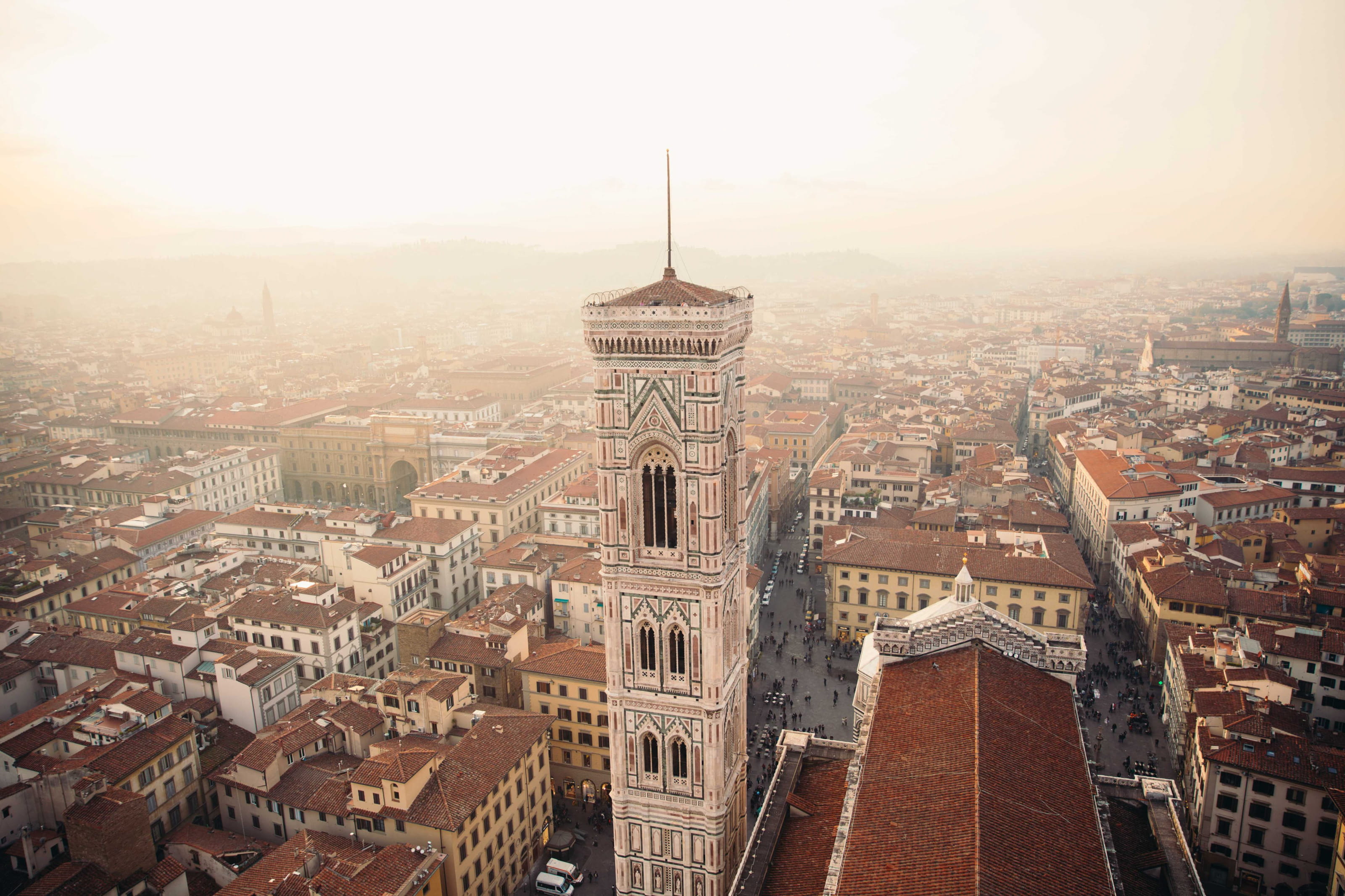 Towers in Florence Italy surrounded by clay rooftops of residences 2k