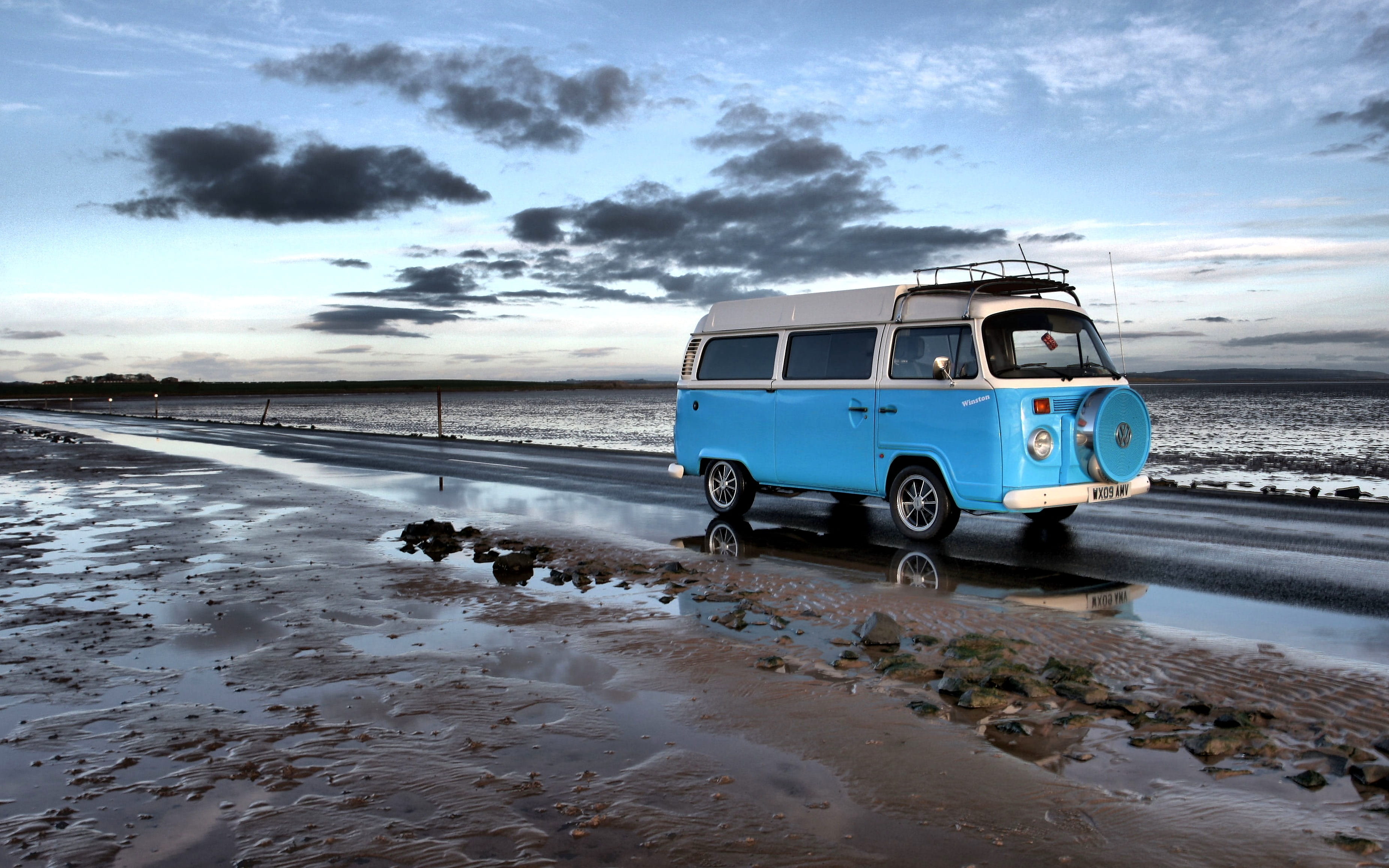 White and Blue Van on Road beach campervan drive ocean sand 2k 4k