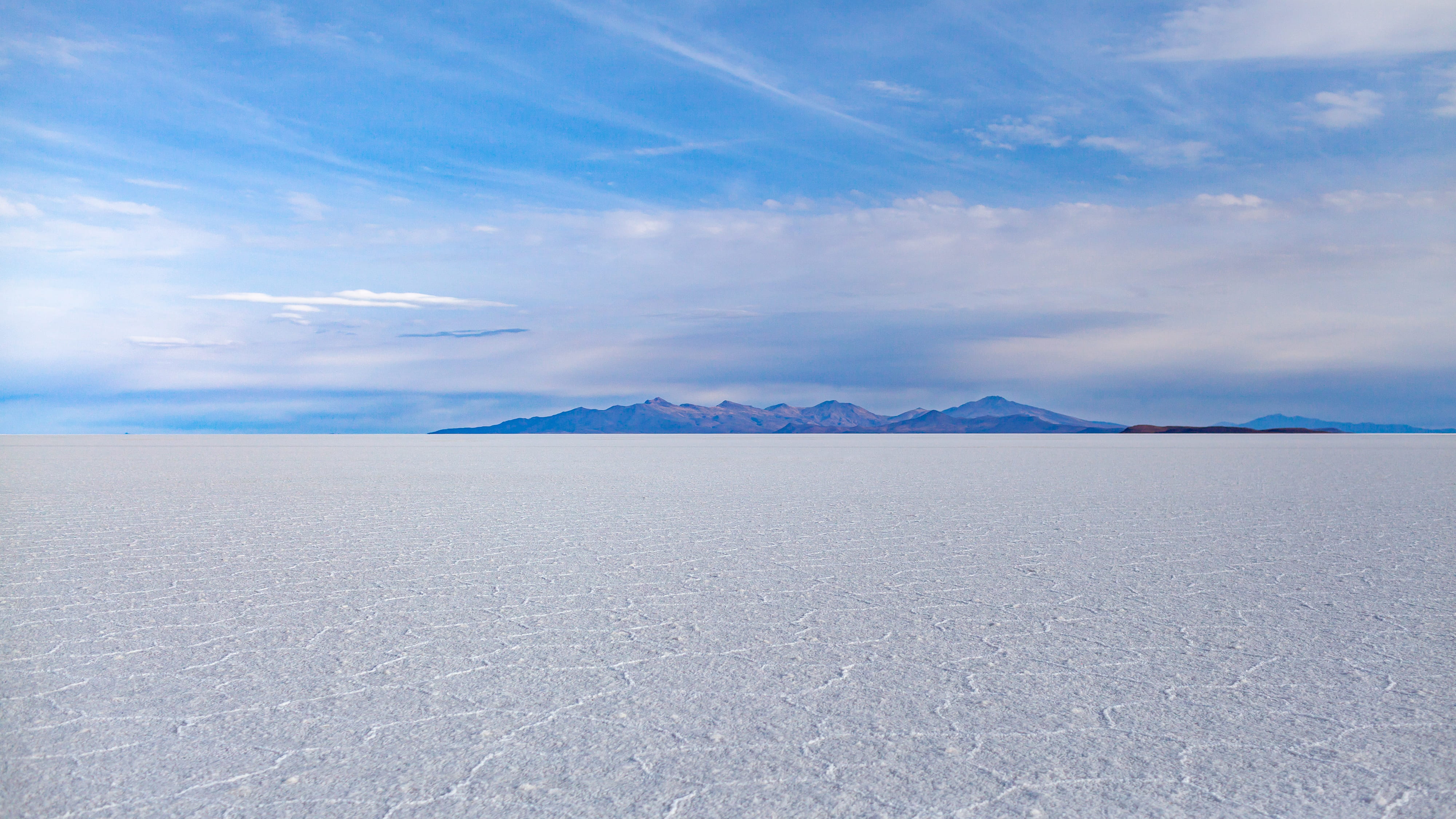 body of water under cloudy sky bolivia uyuni salt flat desert 2k 4k