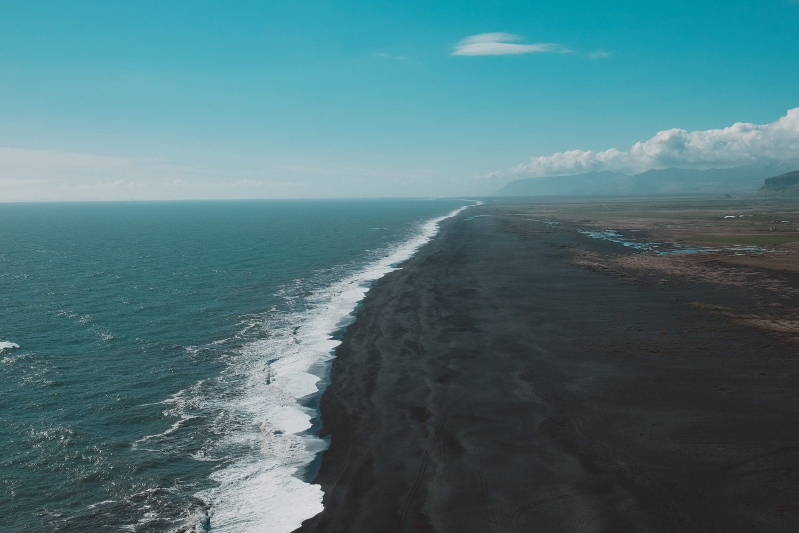 brown sand nature water beach Iceland black sea sky 2k 4k