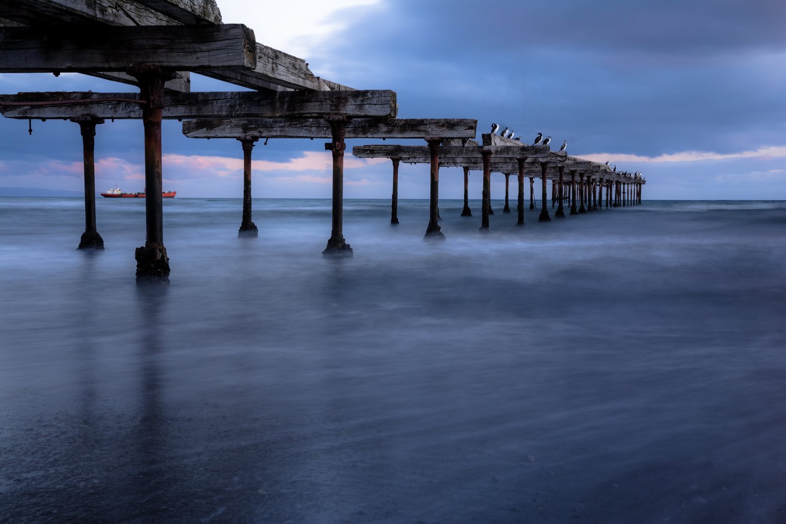 gray wooden bridge above body of water Estrecho de Magallanes 2k 4k 5k