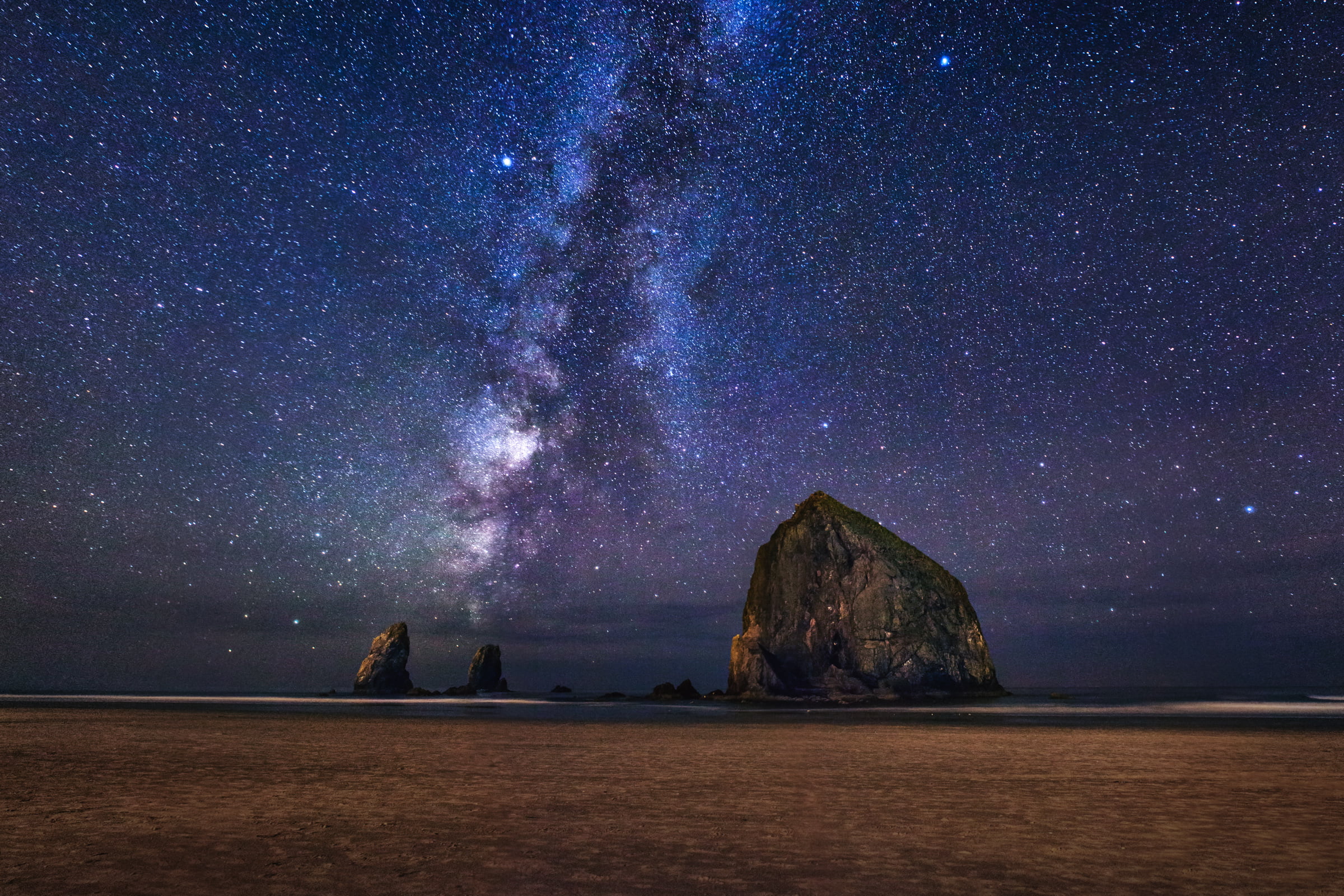 low angle photo of night sky during nighttime cannon beach matti 2k