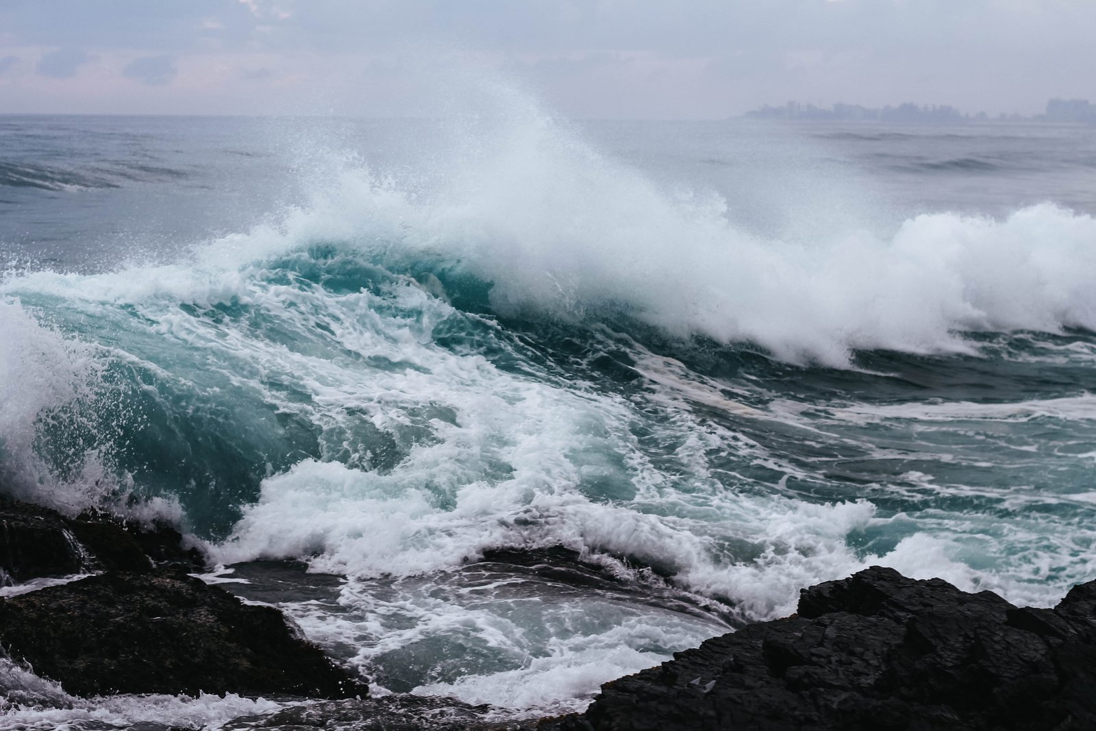 ocean waves hitting rock in beach sea at shore coast 2k 4k 5k