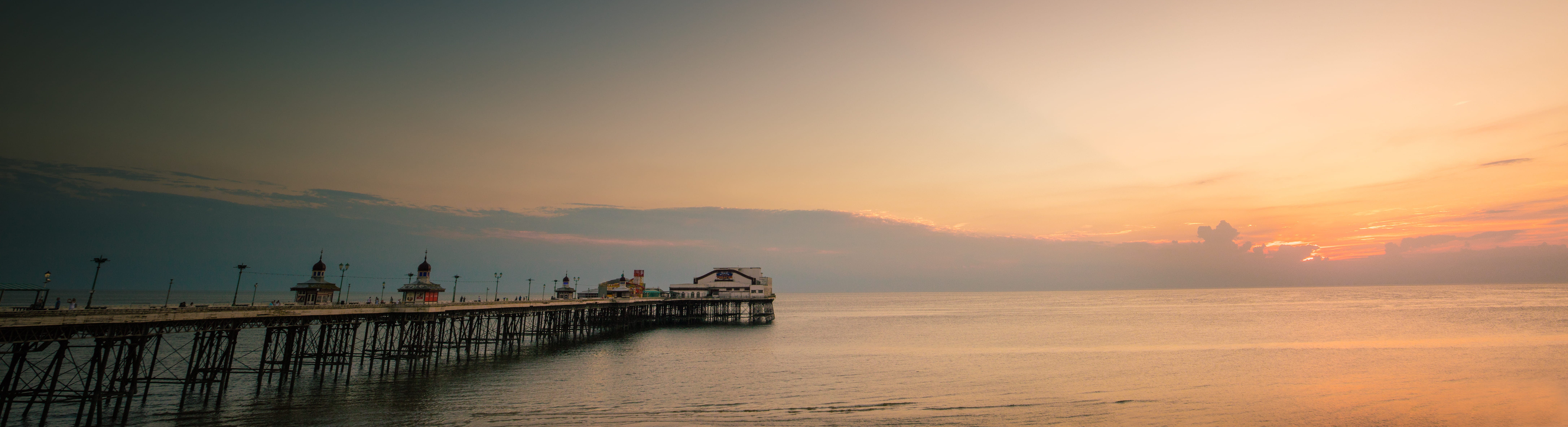 brown wooden bridge over body of water pier dock blackpool 2k 4k 5k 8k