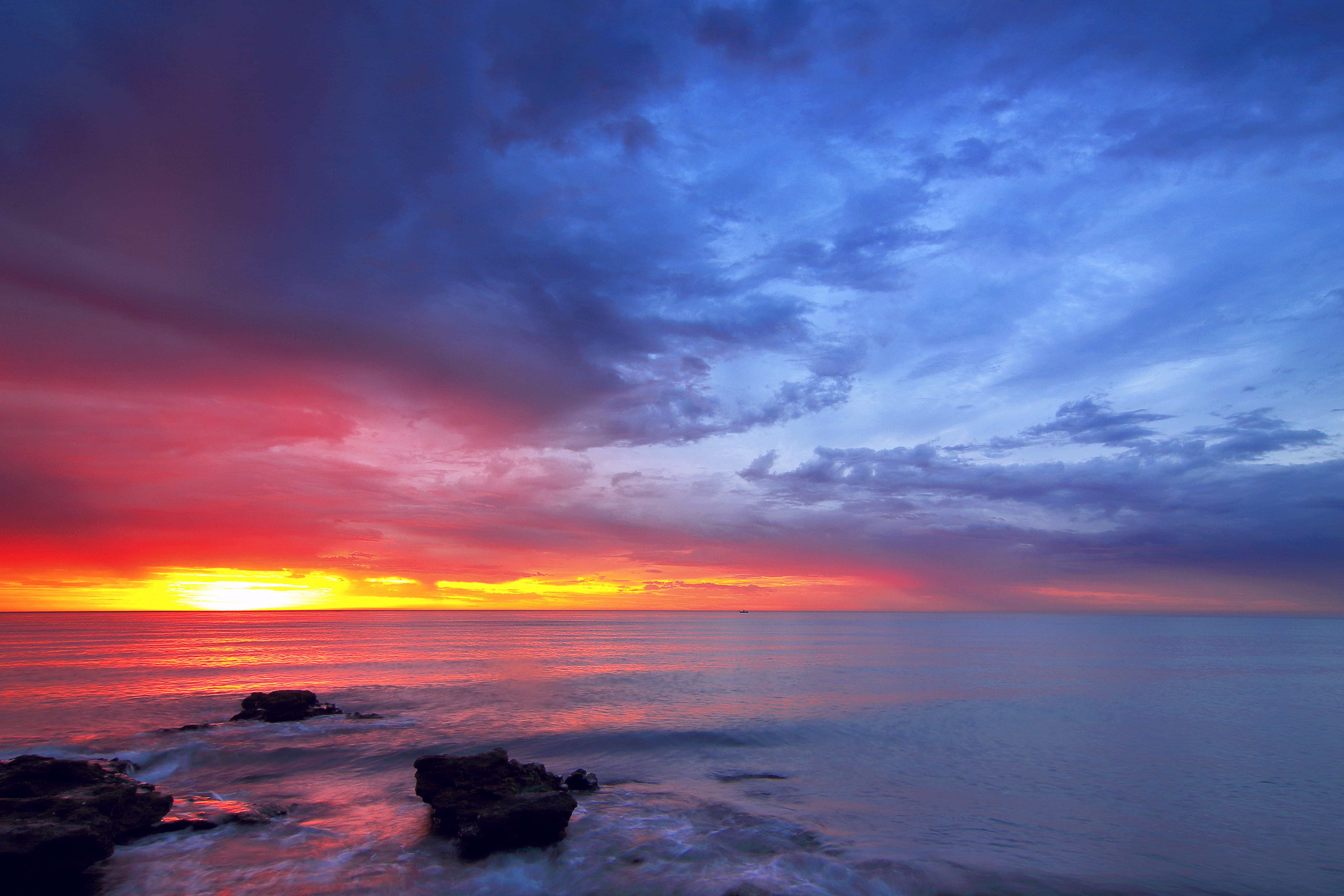 calm sea with rocks during golden hour nature outdoors dawn 2k 4k 5k