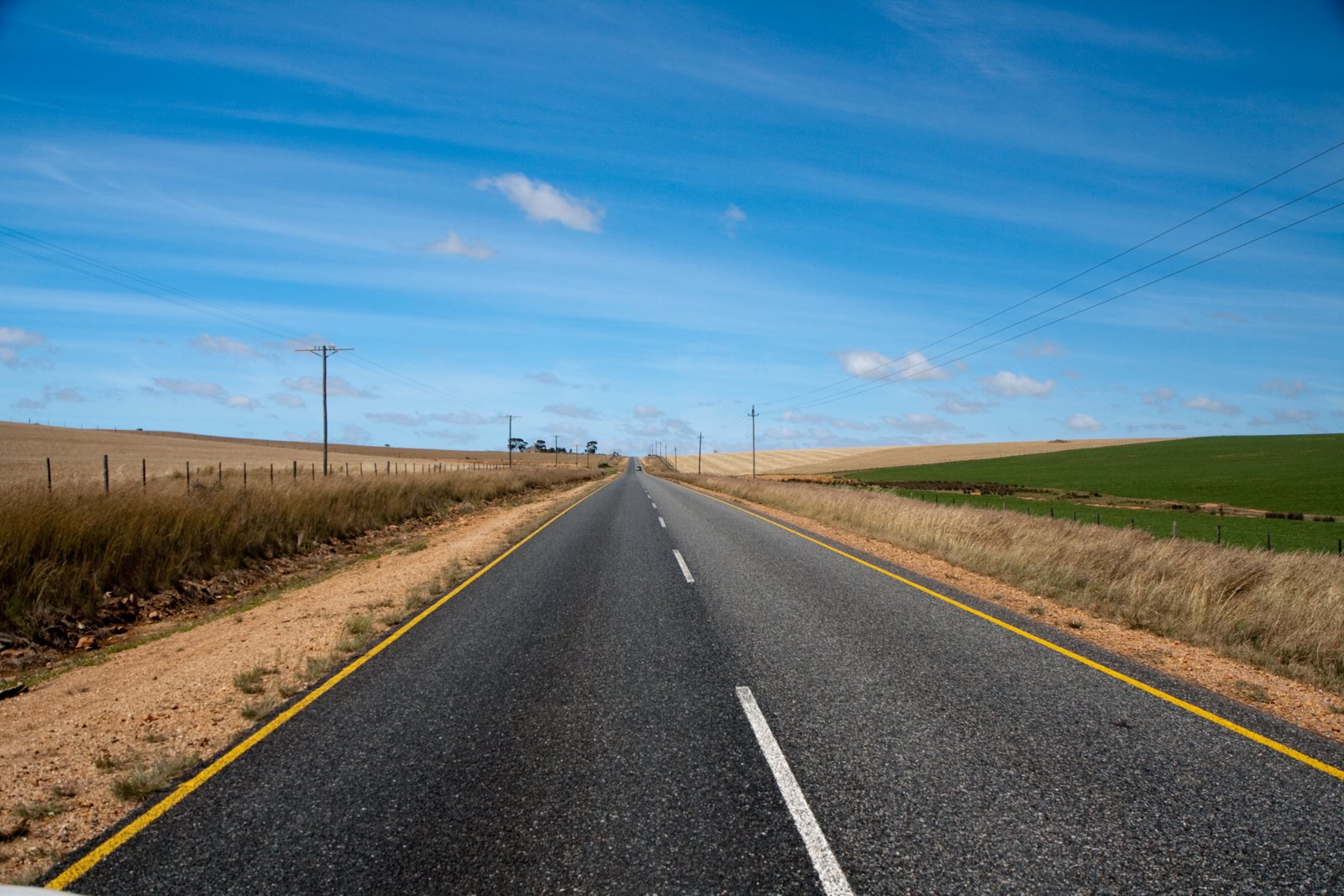 gray road pavement with brown grass africa South Africa 2k 4k